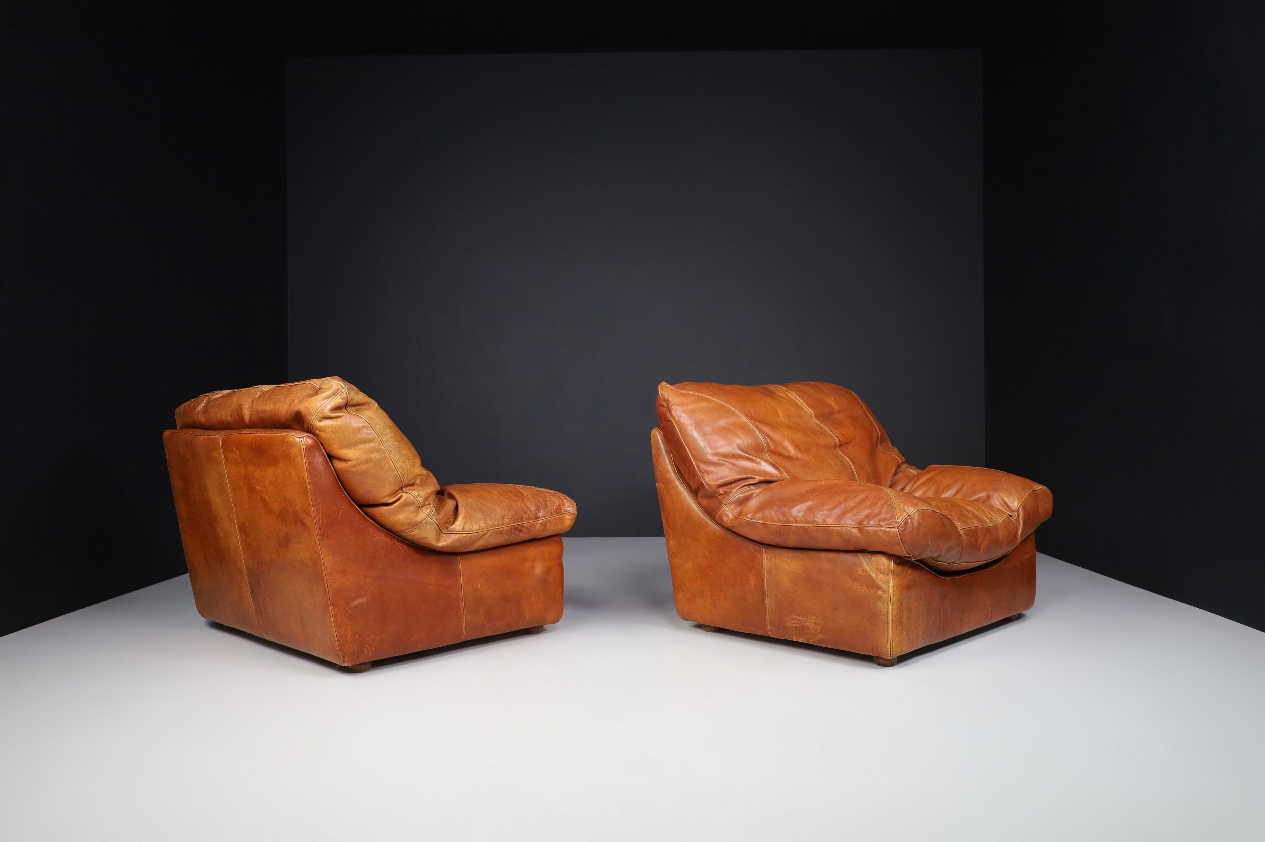 20th Century Lounge Chairs in Patinated Cognac Leather, France 1970 For Sale