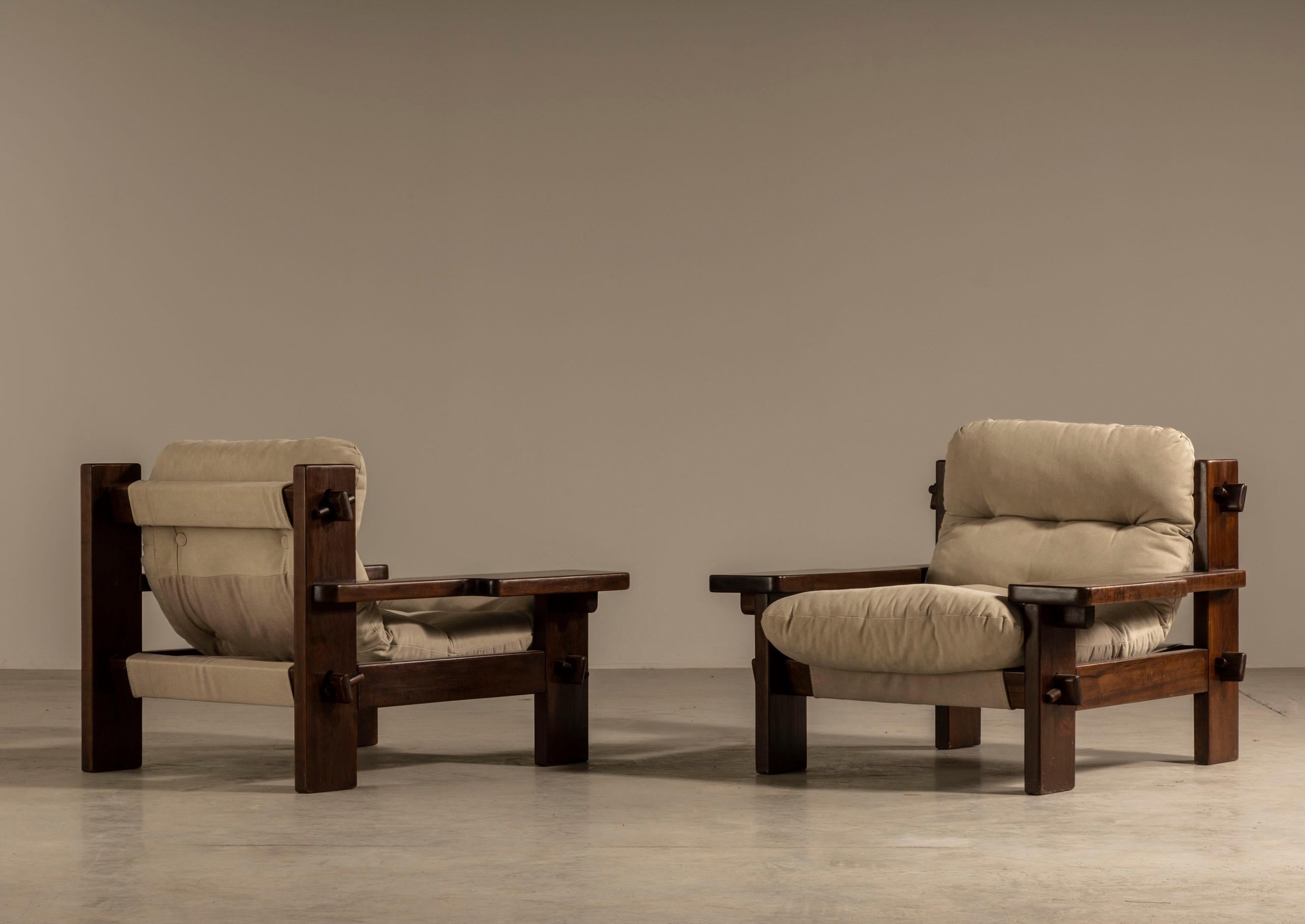 Jean Gillon Mid-Century Lounge Chairs: A Masterpiece of Brazilian Modernist Design
This pair of mid-century lounge chairs by Jean Gillon exemplifies the designer's unparalleled ability to blend robust materials with refined aesthetics. Crafted in