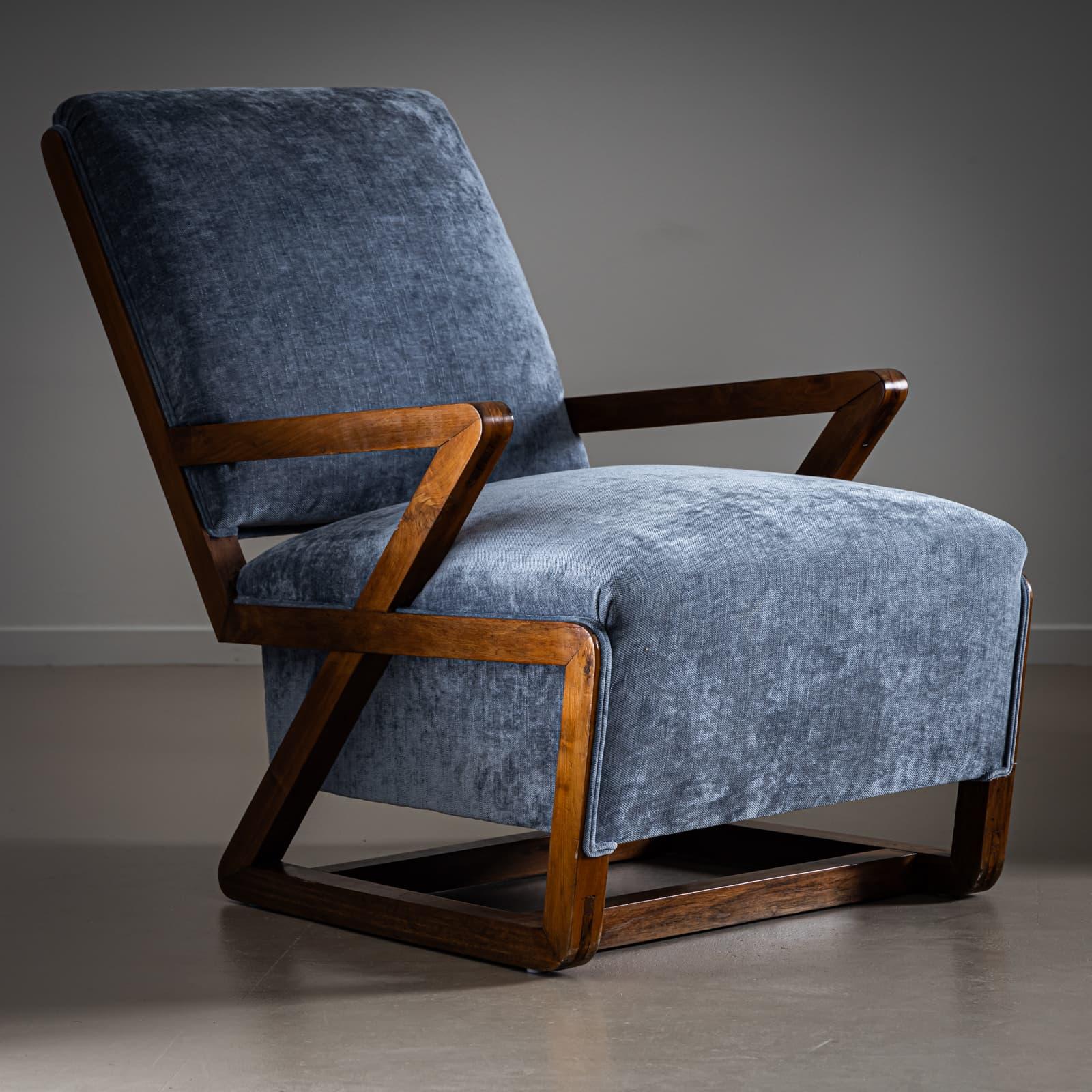 Two lounge chairs with gray velvet upholstery and geometric frame made of solid walnut. Armchairs newly upholstered and polished. 