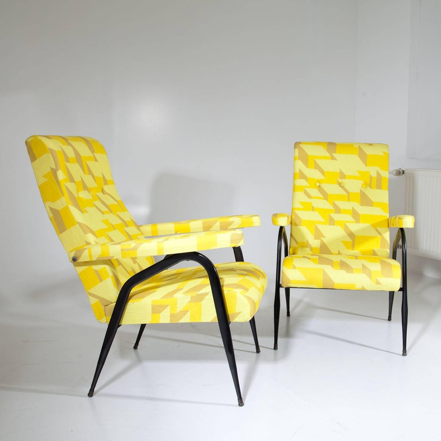 Pair of yellow armchairs with adjustable backrests, standing on bent black metal legs. The lounge chairs were reupholstered with a high quality fabric by designer Eley Kishimoto.