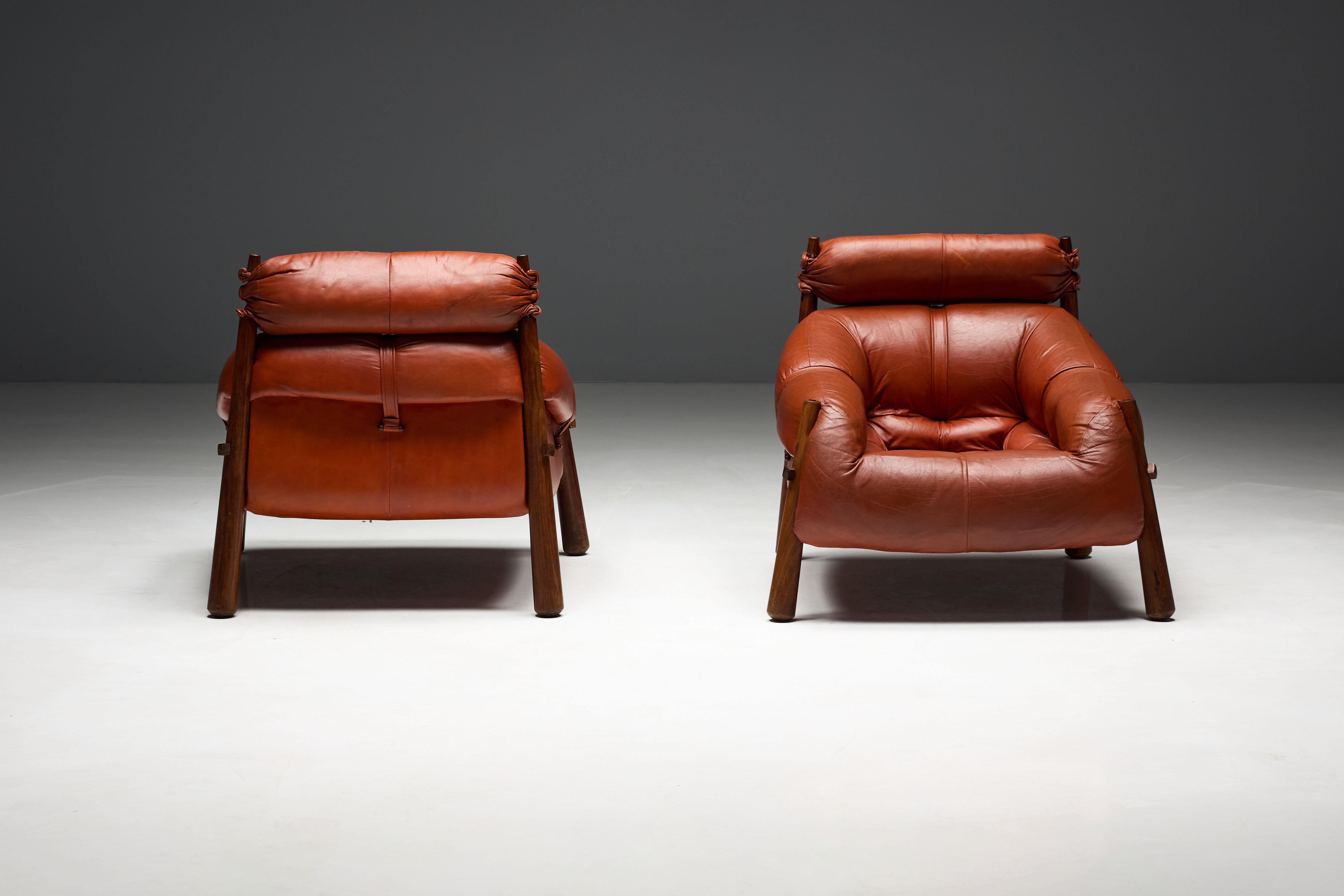 MP-81 lounge chairs by Percival Lafer, designed in the 1970s, exemplary pieces of Brazilian mid-century modern design. These chairs feature beautifully restored red leather paired with jacaranda wood frames, perfectly embodying Lafer's vision of