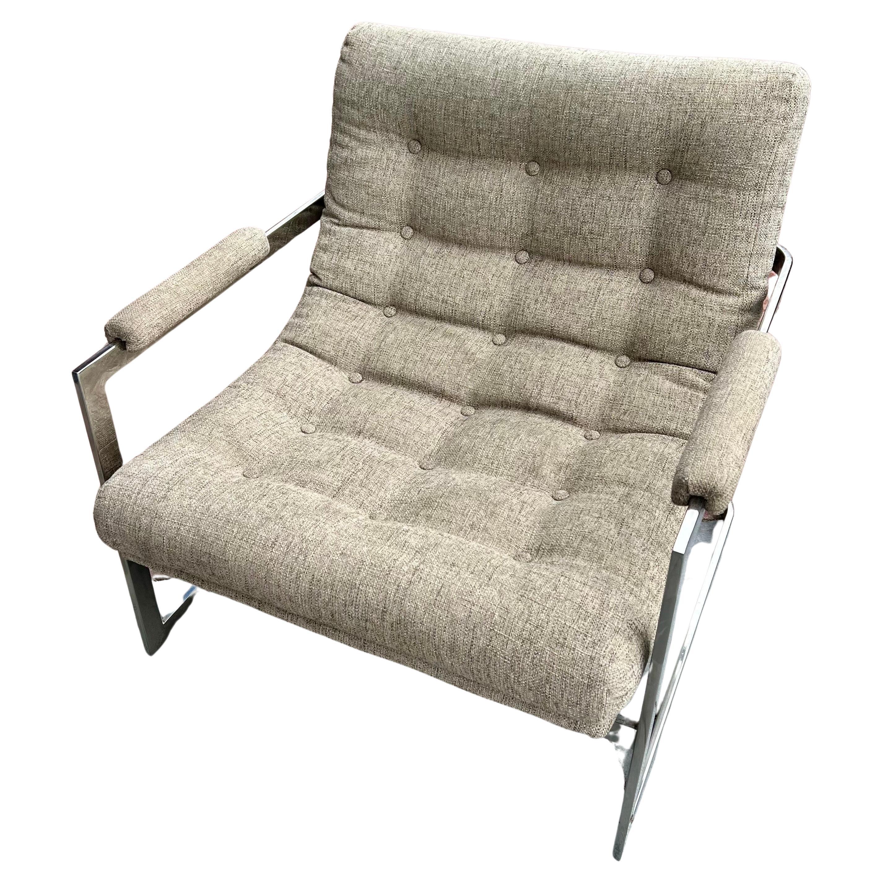 Nice polished chrome frame and upholstered lounge armchair designed by Milo Baughman, circa 1970, upholstered in 2020 the fabric shows a water stain shown nothing major Knoll fabric, Sold As/is nice and comfy chair seats low solid, and sturdy has a