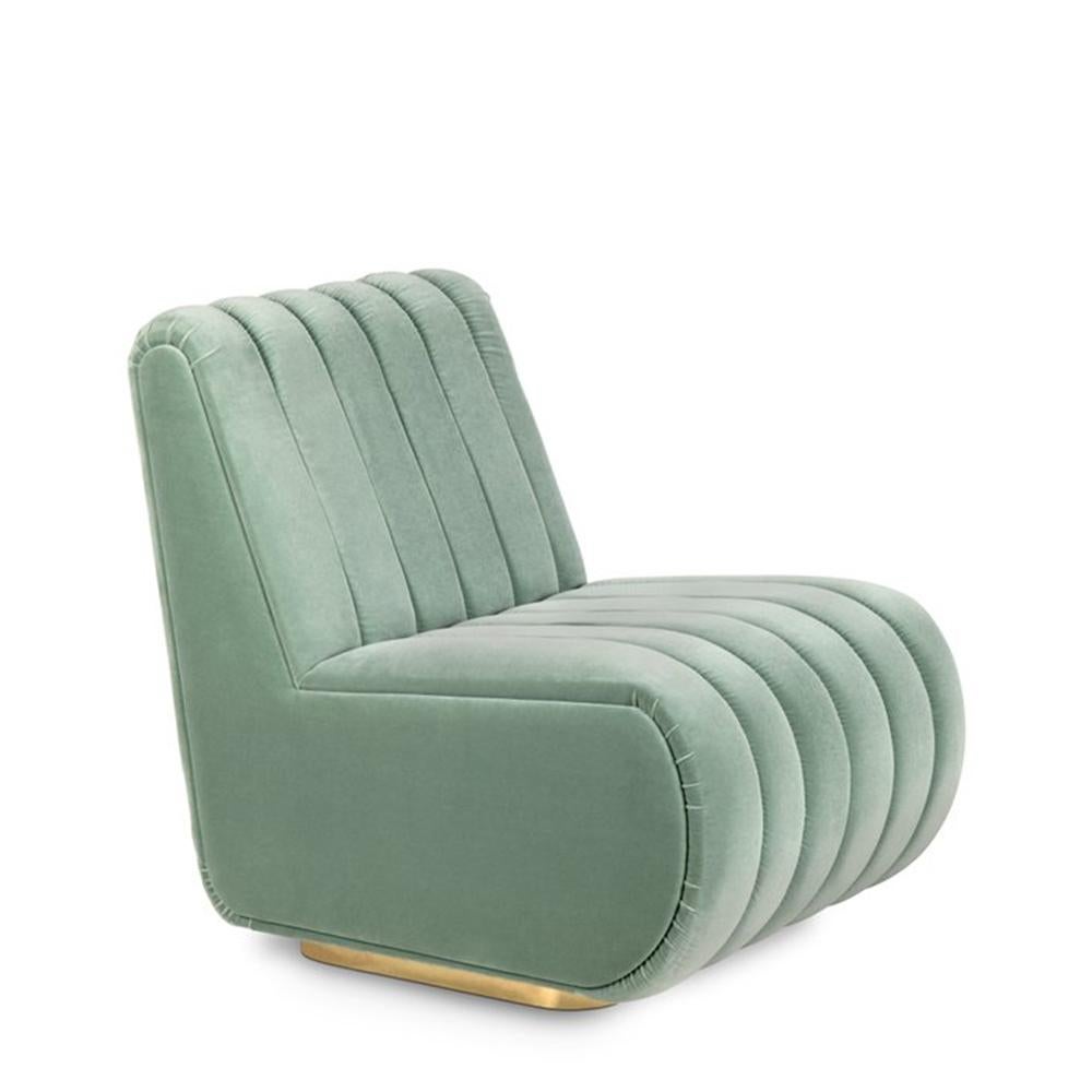 Chair Lounge Dune with wooden structure, upholstered and 
covered with mandel green velvet fabric and stitched from the 
top to the bottom. Base in polished solid brass.
Thee slightly degree reclining turns it into a lounge Chair.
Also available