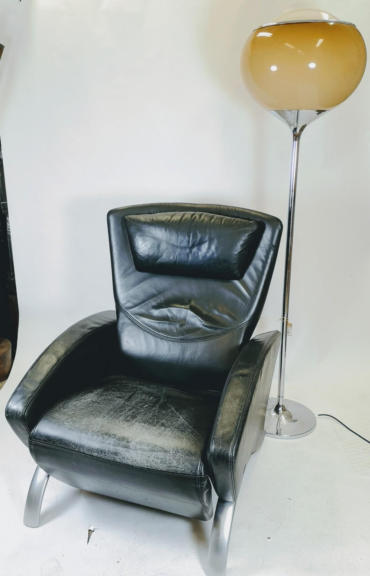 Adjustable lounge leather armchair by Rolf Benz. Extendable foot rest and adjustable back. Silver painted steel legs, with original Rolf Benz stamp. From around the 1980s. Leather has some small fading, scratches.