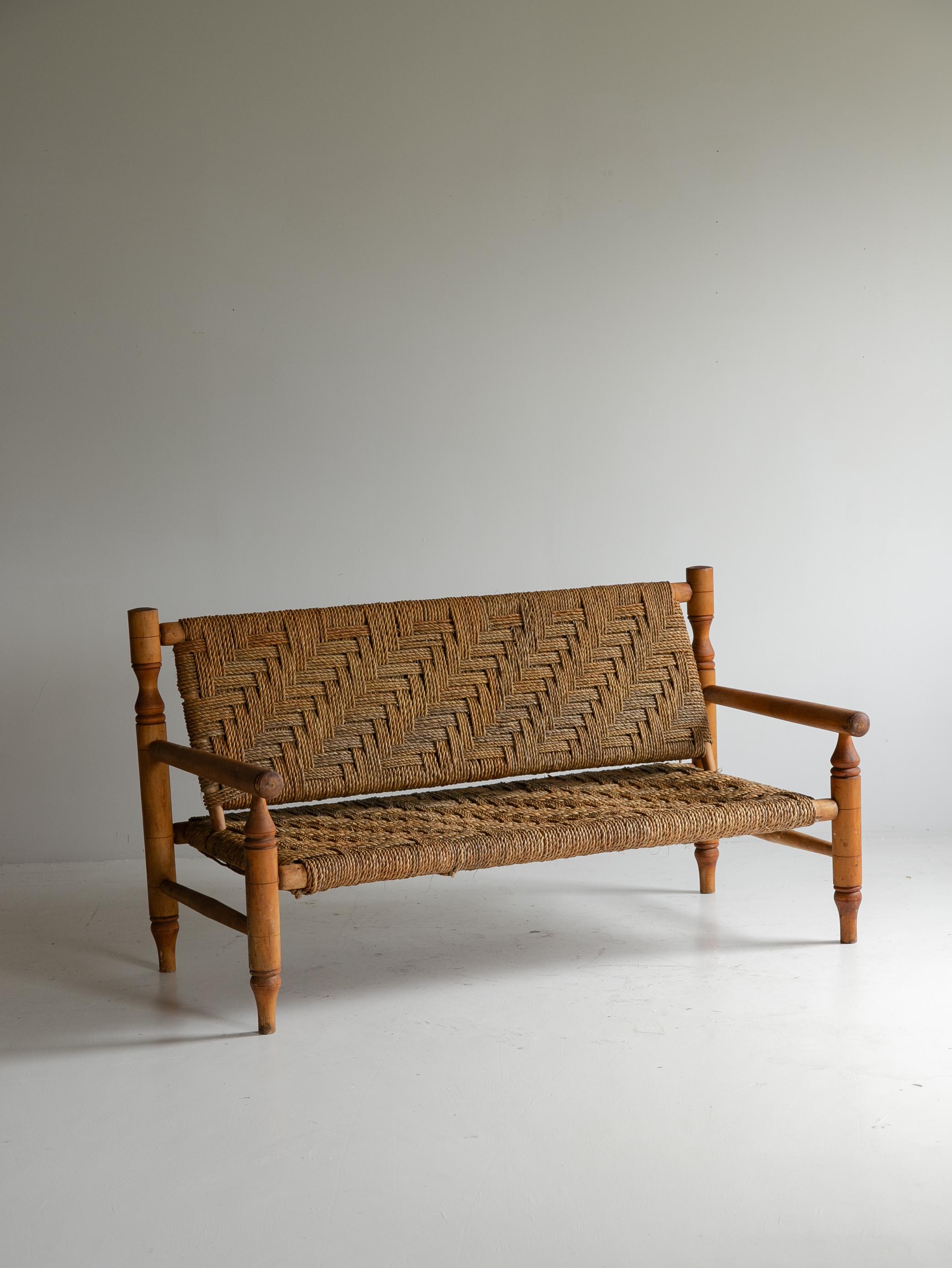 Lounge Sofa by “Audoux-Minet”

Adrien Audoux & Frida Minet met in the Provence region of France during the 1940s and began collaborating on design projects. Their work reflects a rustic, artisanal aesthetic characteristic of the region and is noted