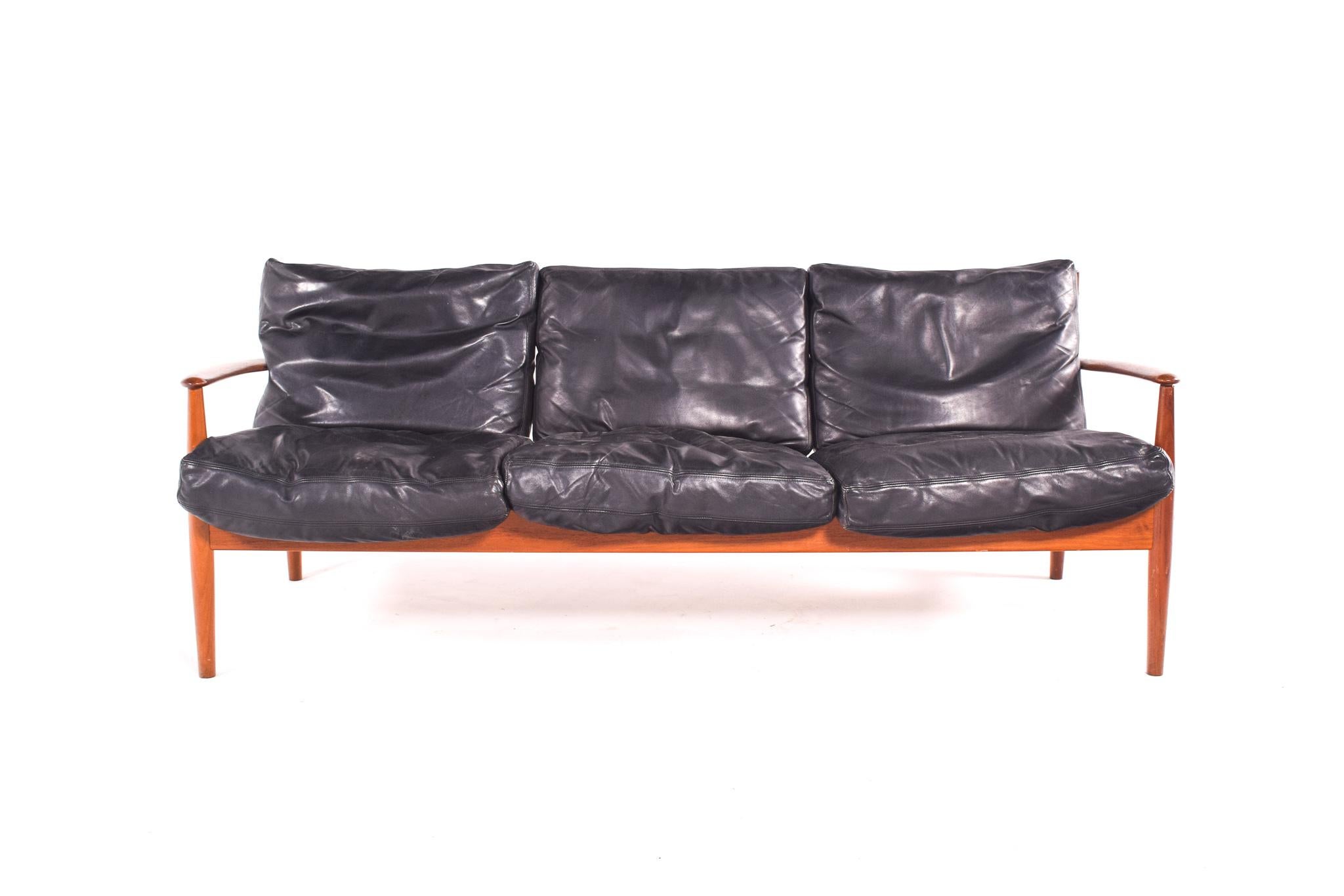 So beautiful and useful. This lounge sofa model 118 designed by Grete Jalk for France & Son in Denmark c1960, made of solid teak and has the original black leather cushions. 3 seater sofa marked with the France & Son metal tag.
Grete Jalk was a one