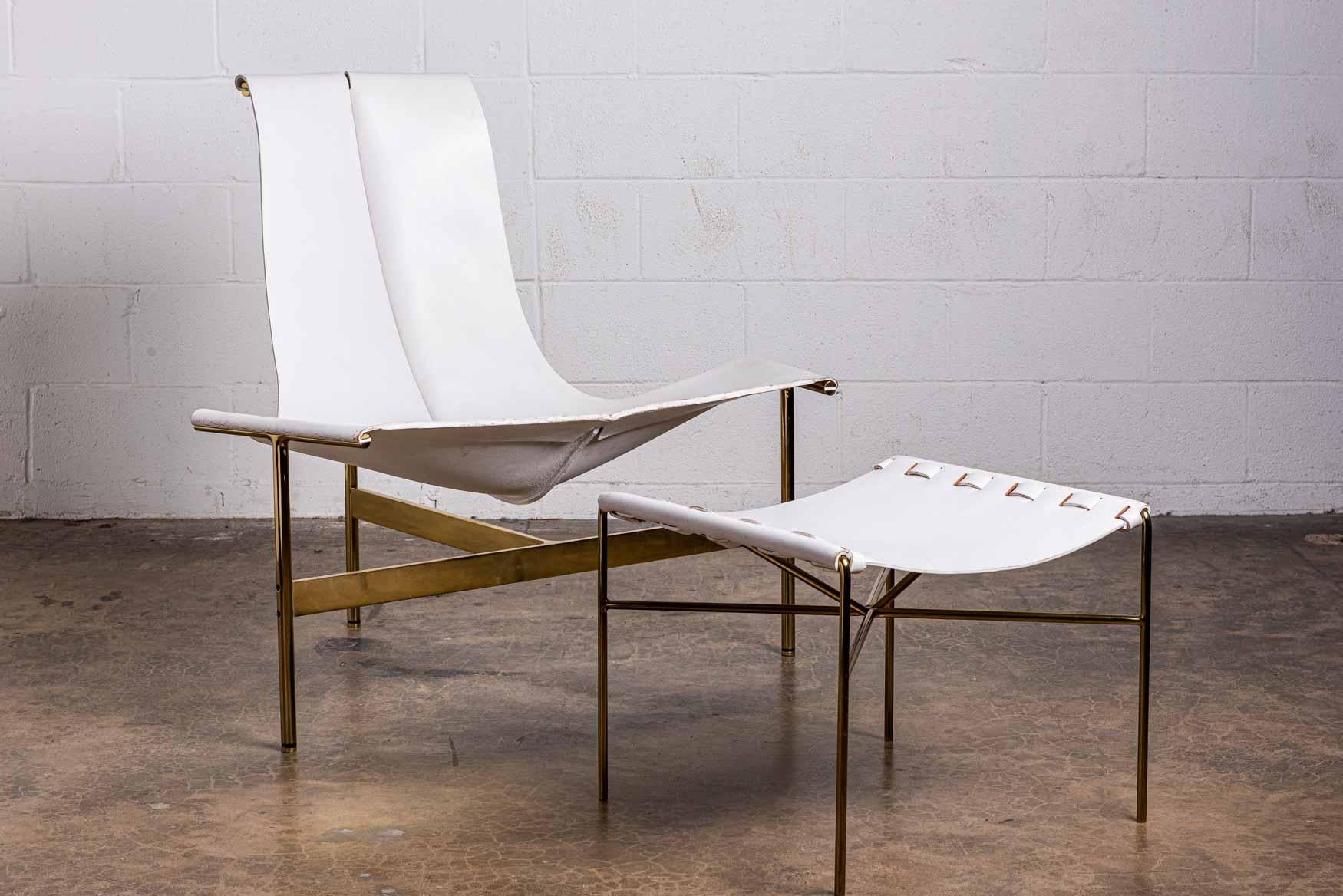 A t-chair and ottoman with brass frame and white leather. 

Chair: 40.75 W x 31.5 D x 36.5 H / 18.75 SH
Ottoman: 20.5 x 20 x 16.75 H.