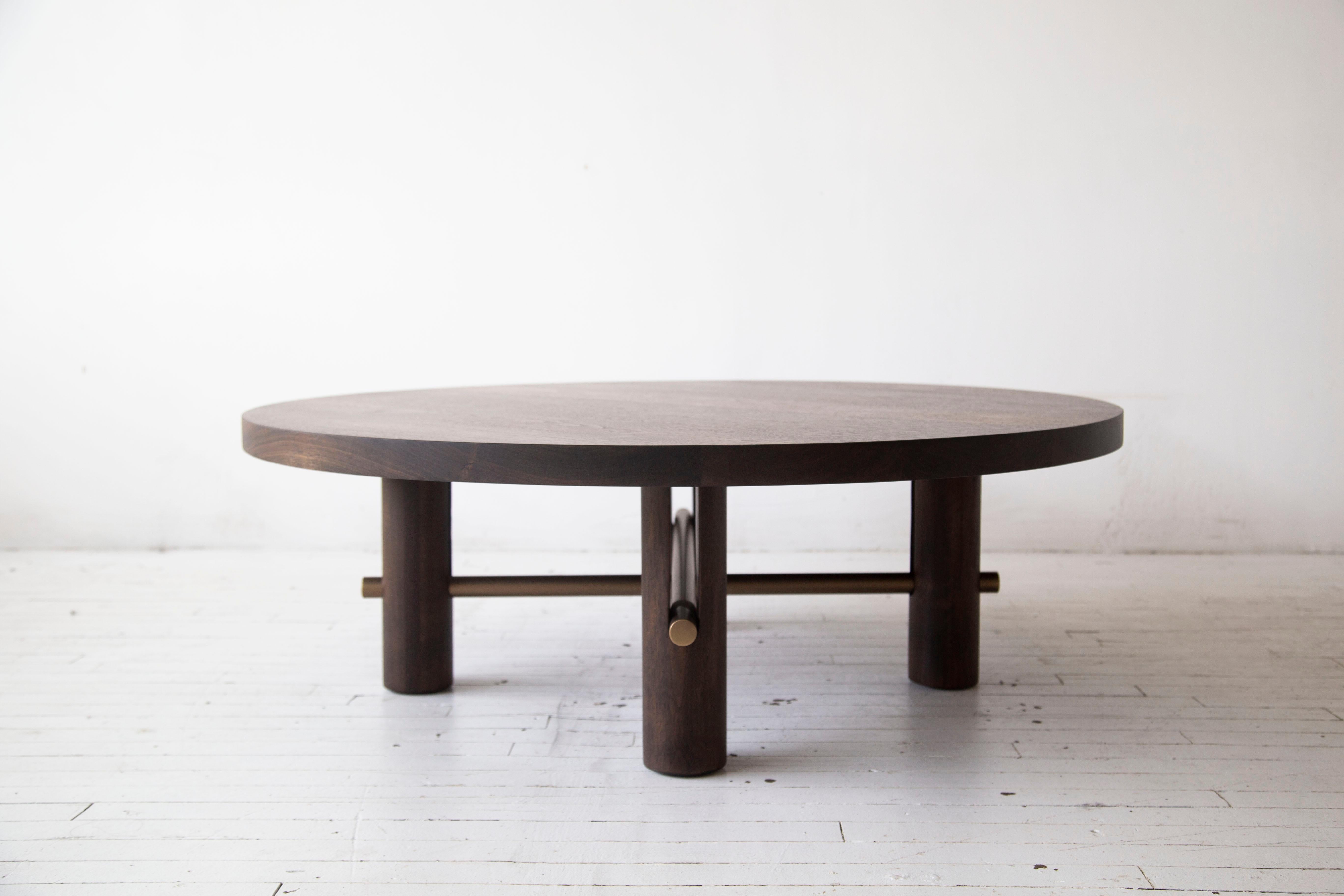 The Loup coffee table is a timeless piece
that explores movement and mass. Its
legs are cradles for the solid metal rods
that seemingly push their way through the
forms. A delicate connection to the table
top is balanced by the solid legs