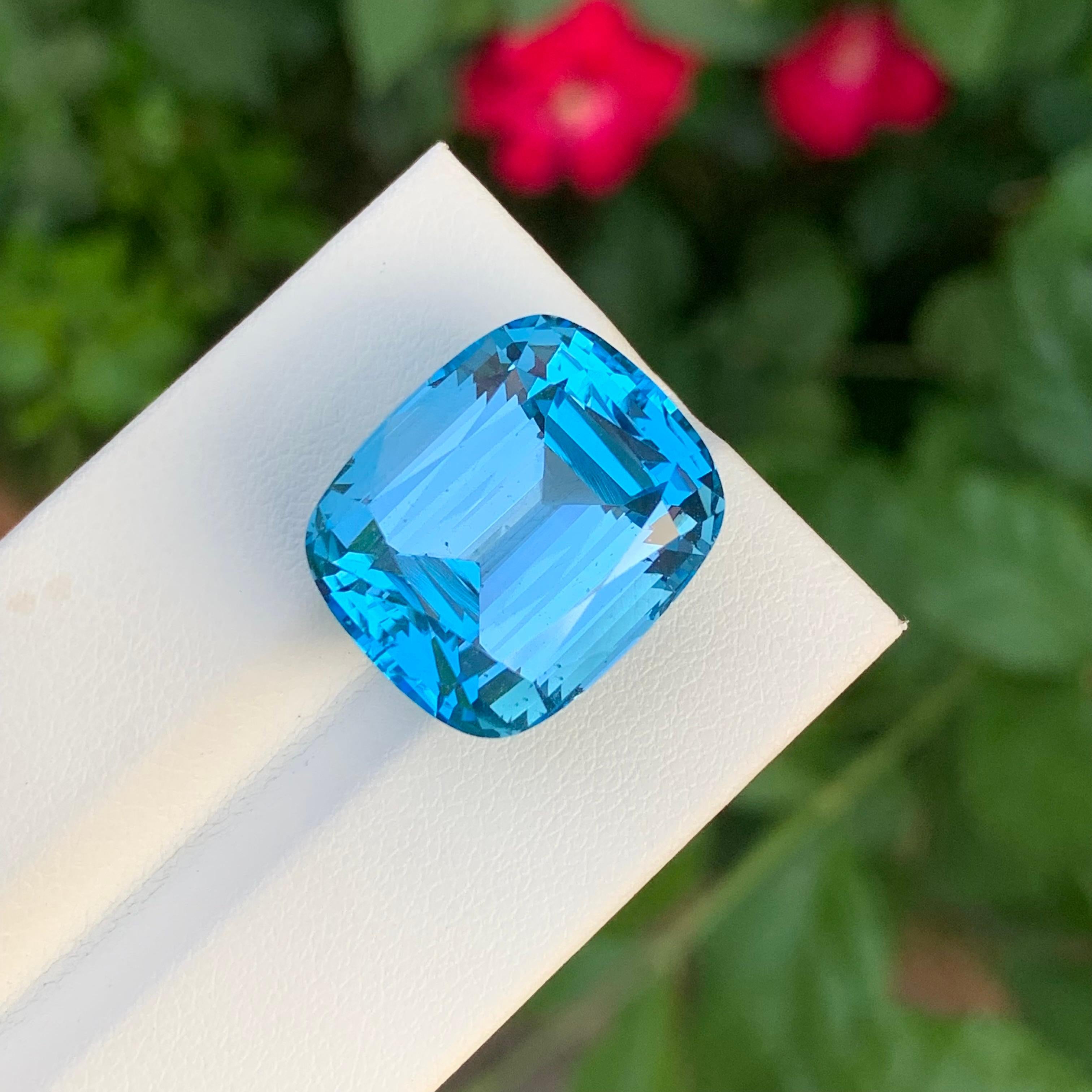 Faceted Swiss Blue Topaz 

Weight: 32.50 Carats 
Dimension: 19 x 16 x 12.3 Mm
Colour : Blue 
Shape: Cushion 
Origin: Brazil 

Swiss blue topaz is a vibrant, light blue gemstone known for its striking clarity and brilliance. It is a variety of topaz,