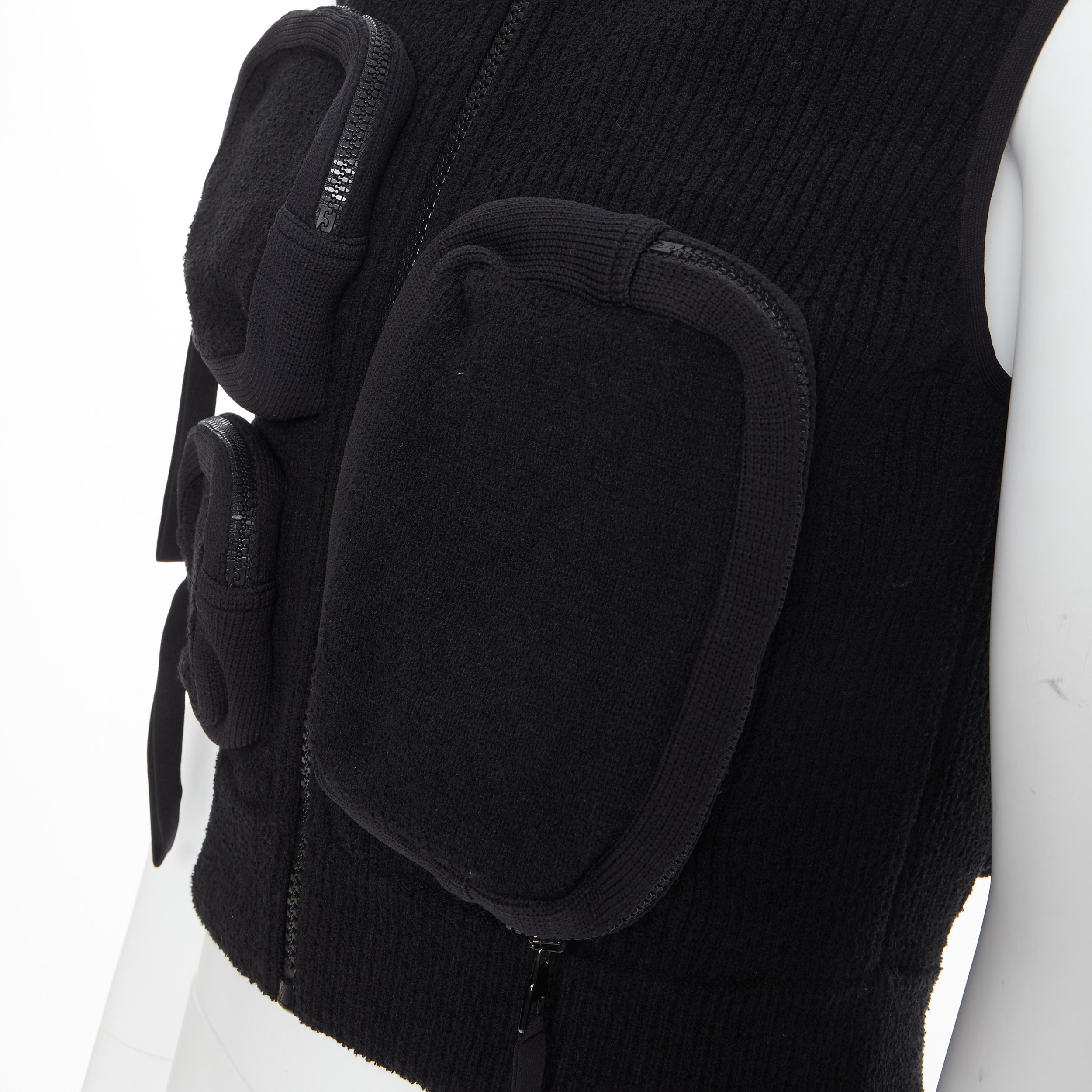 LOUS VUITTON Virgil Abloh Multi 3D Pocket utility zip pocket ribbed zip vest M 
Reference: TGAS/B01047 
Brand: Louis Vuitton 
Designer: Virgil Abloh 
Material: Polyamide 
Color: Black 
Pattern: Solid 
Closure: Zip 
Extra Detail: Multi 3D pockets.