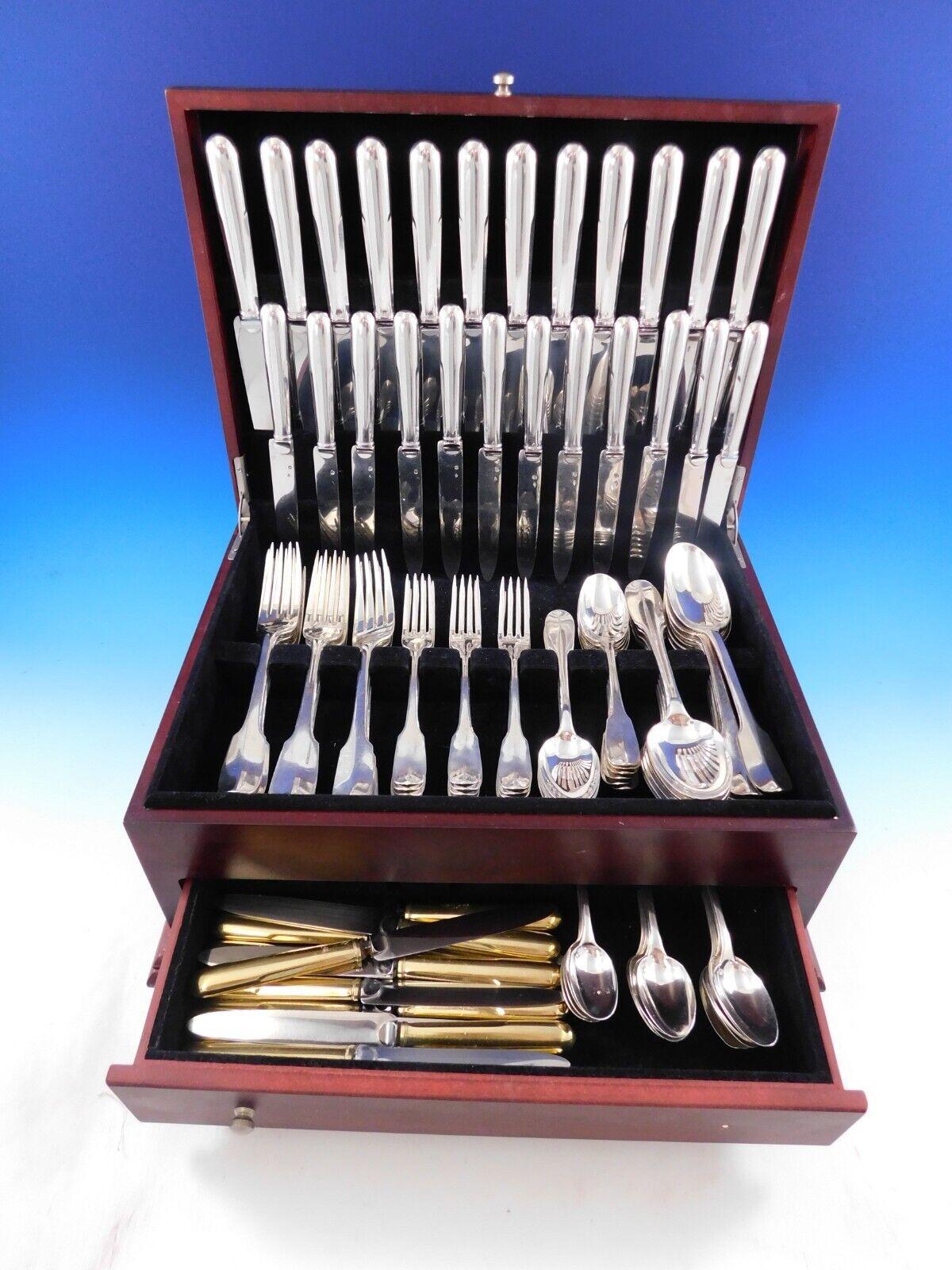 The Parisian silversmith Puiforcat is regarded as one of the legendary names in European silver craftsmanship. 
Superb Dinner Size Louvois by Puiforcat sterling silver flatware set, 104 pieces.This set includes:

12 dinner size knives, pointed, 9