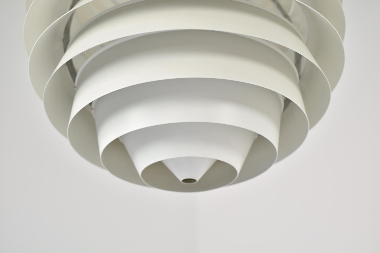 Stunning ‘Louvre’ pendant designed by Poul Henningsen for Louis Poulsen, Denmark, 1957. Originally designed for the Adventist Church in Skodsborg. Created from 13 matte white lacquered shades that provide a uniform light spreading. Beautiful