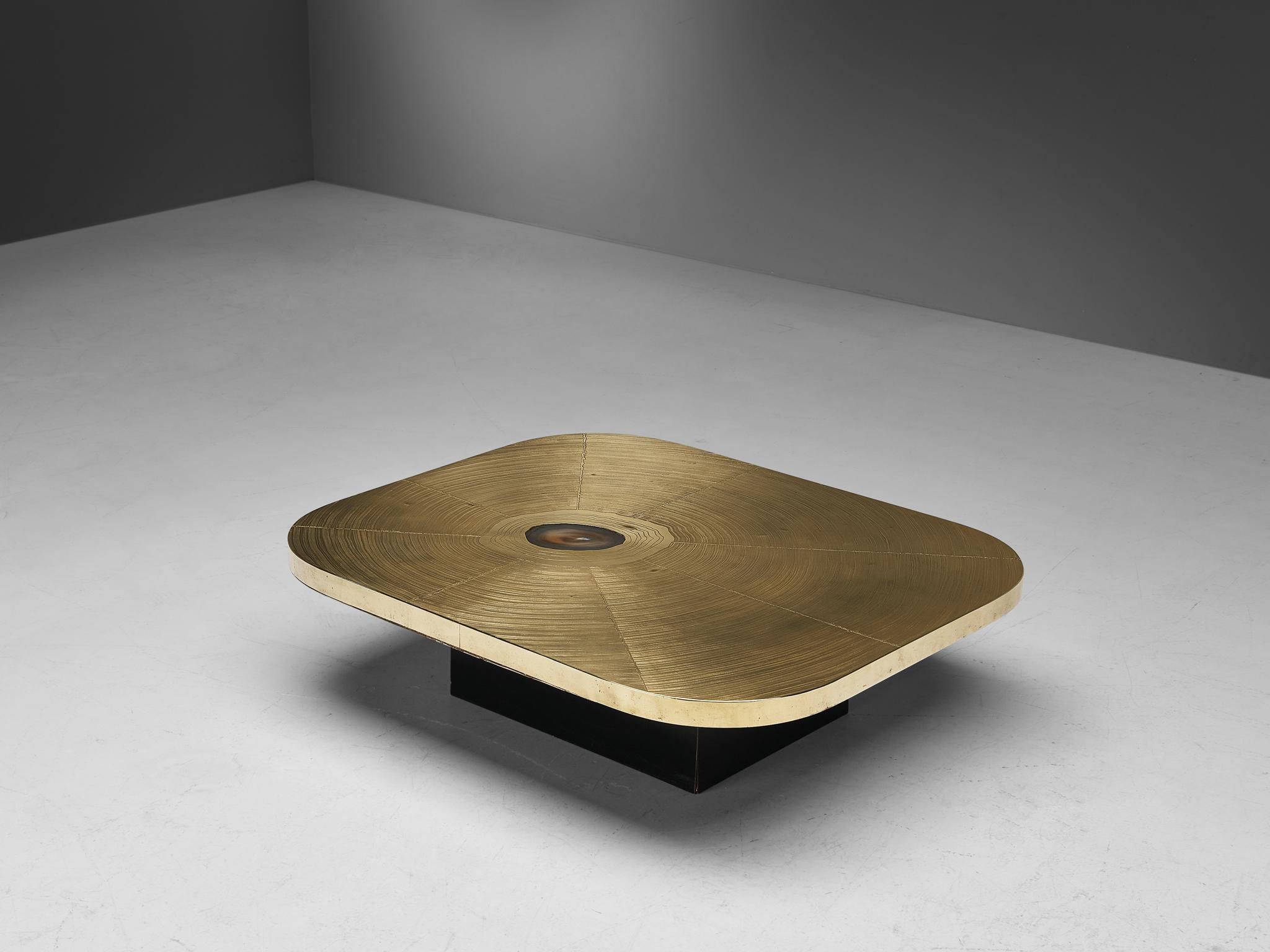 Lova Creation, coffee table, brass, wood, agate, Belgium, 1980s

This luxurious side table by Lova Creation is a dazzling eyecatcher. The golden square tabletop is signed and shows a pattern of large abstract brush strokes. The top is inlayed with