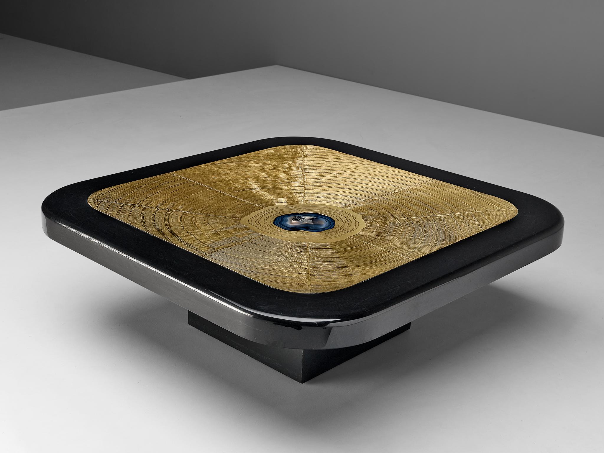 Lova Creation, coffee table, brass, metal, wood, agate, Belgium, 1987

This luxurious side table by Lova Creation is a dazzling eyecatcher. The golden square tabletop is signed and shows a pattern of large abstract brush strokes. The center is