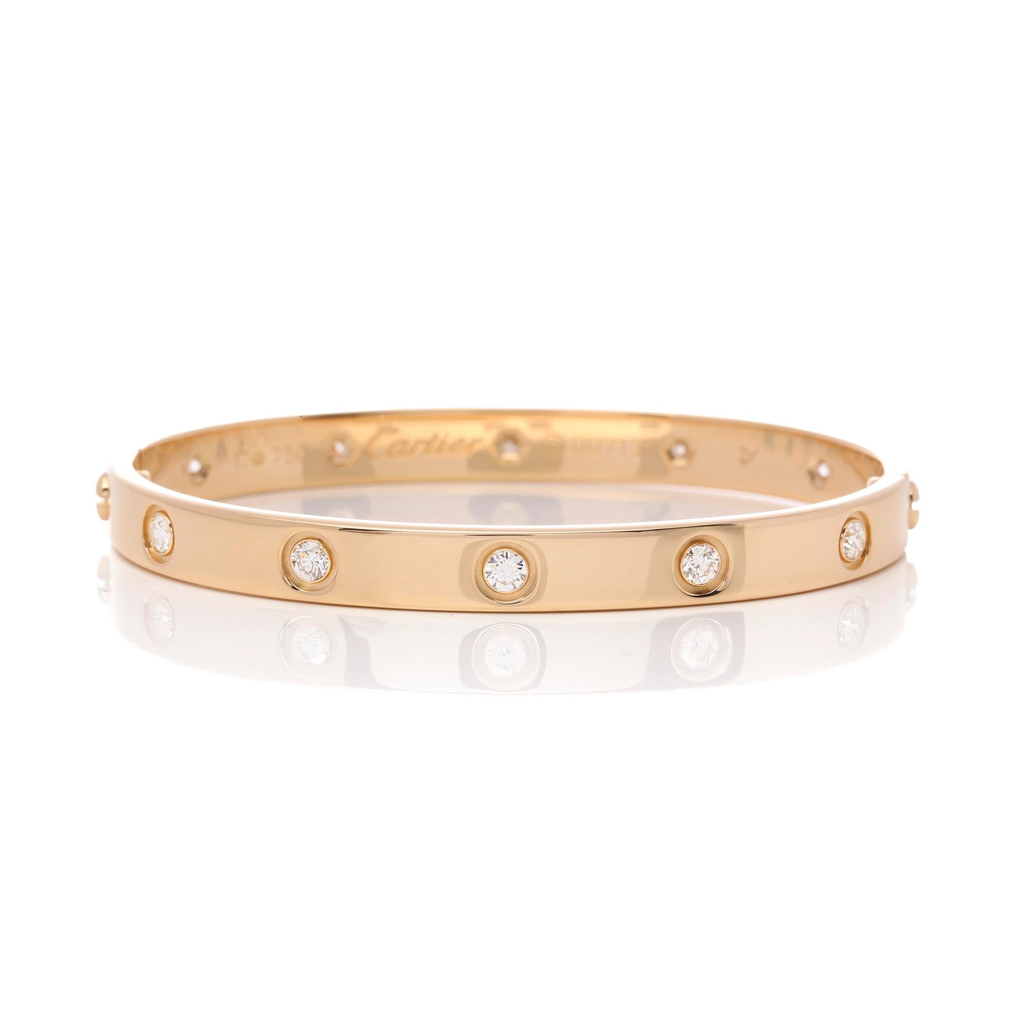 This bangle by Cartier is from their Love Collection and is in 18ct Yellow Gold. It features 10 round brilliant cut diamonds. Complete with Cartier box and certificate. Our Xupes reference is J515 should you need to quote this.