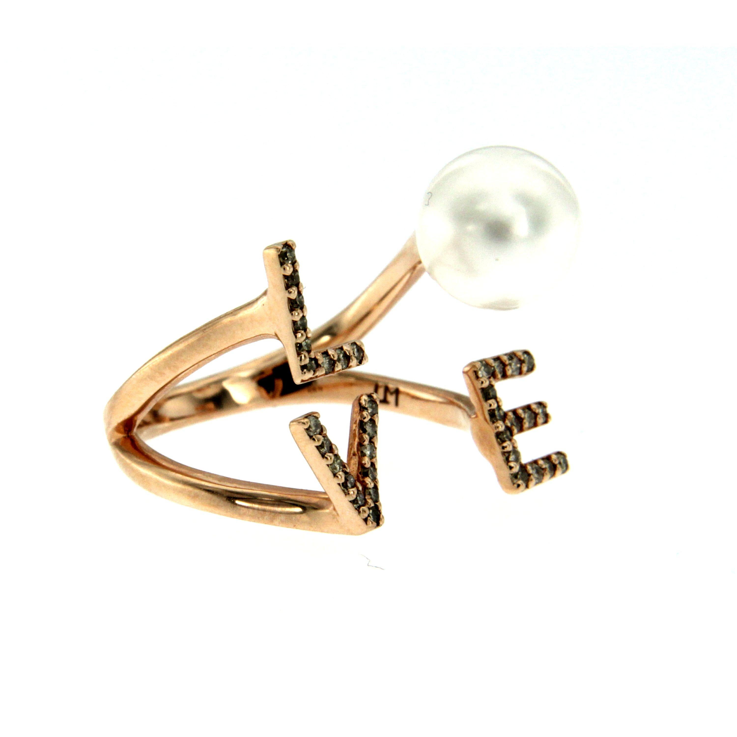 This 14k rose gold ring is adorned with 