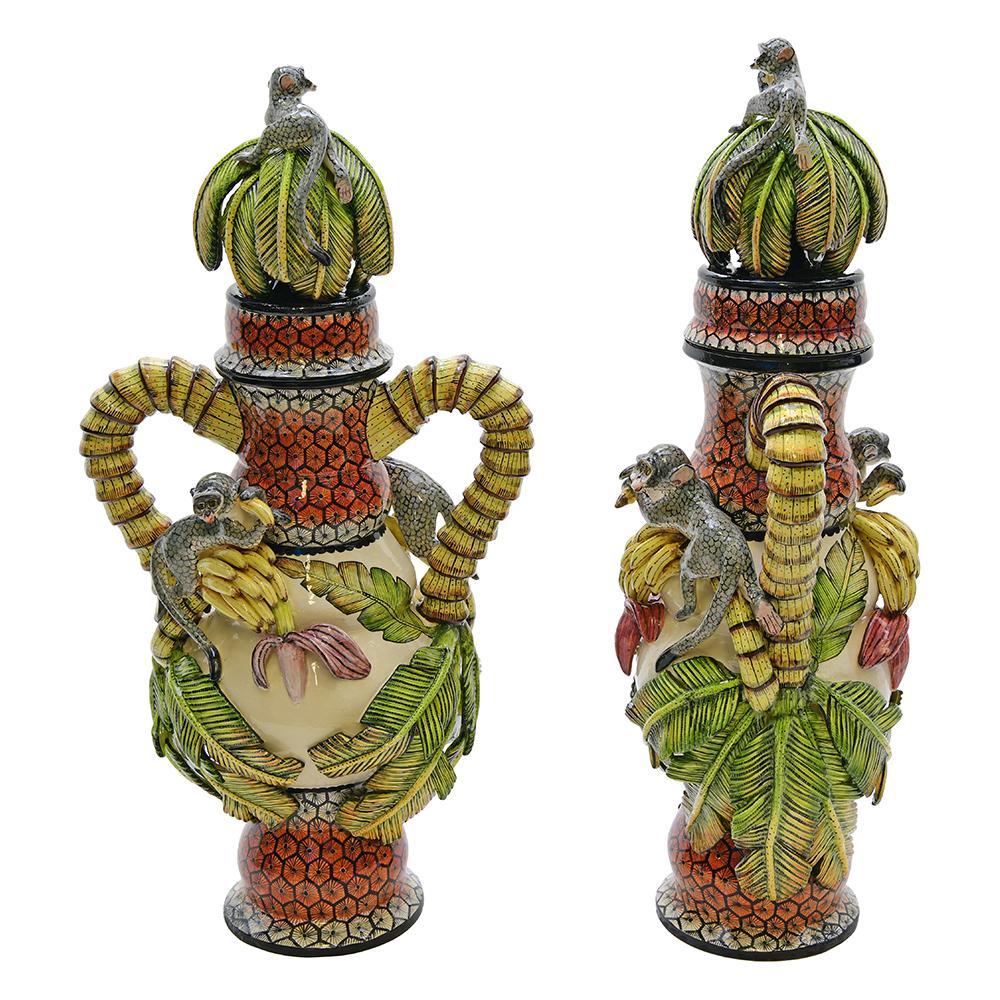 The Monkey urn pair, meticulously crafted by Love Art Ceramic in South Africa, epitomizes the fusion of artistry and cultural symbolism. Hand-sculpted by the skilled hands of Zimhle, Sfiso, and Motsamay, this pair stands 22 inches high, 8 inches