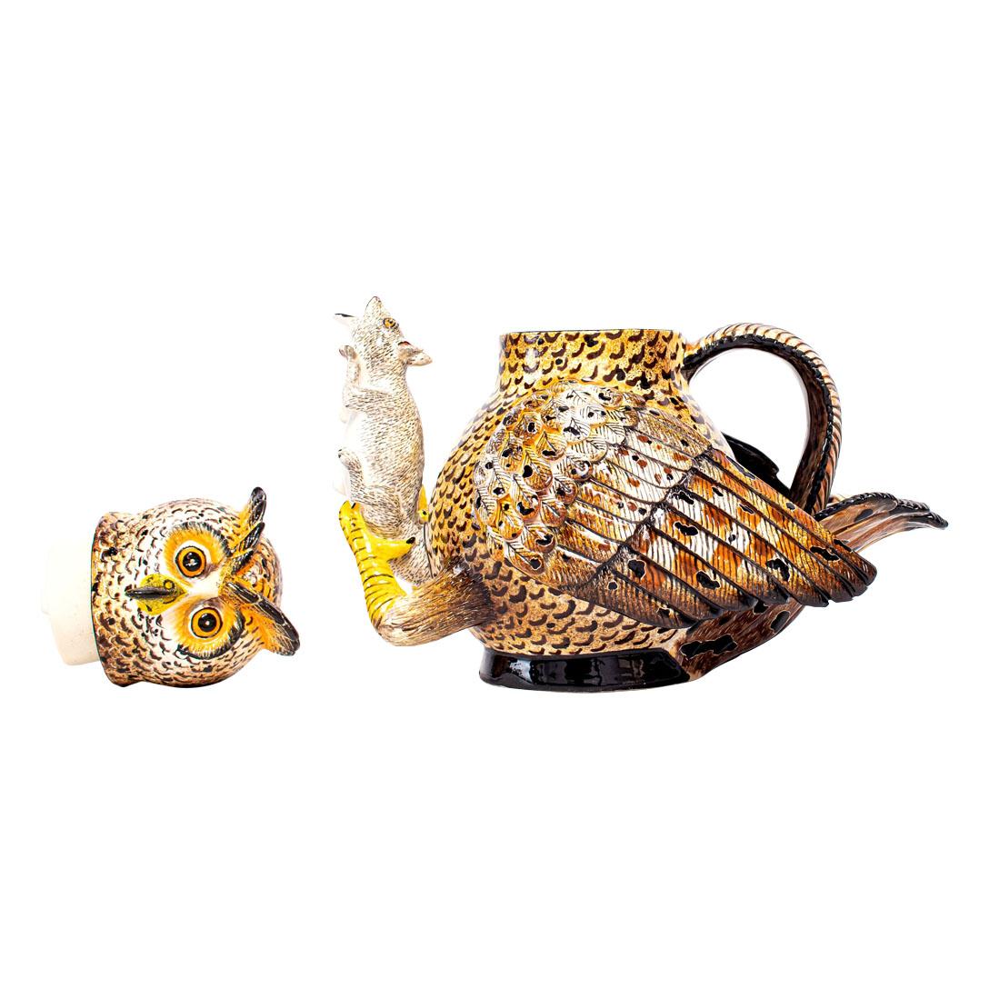 The ceramic Owl teapot, exquisitely hand-painted by Minenhle Nene and skillfully sculpted by Sfiso Mvelase, is a masterpiece from the Love Art Ceramic studio in South Africa. Although its dimensions are not specified, the artistry and cultural