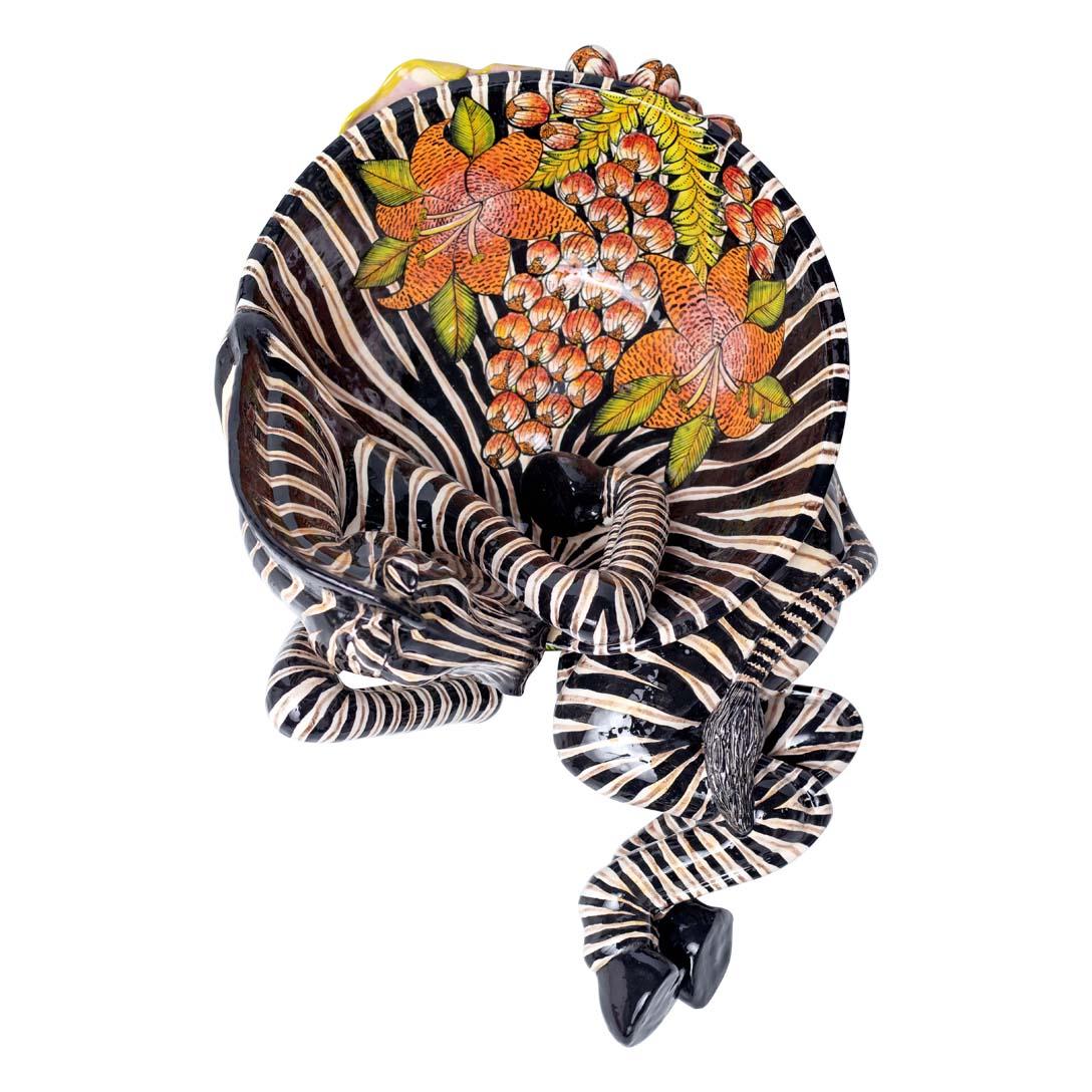 Designed by Love Art Ceramic in South Africa in 2024, The Zebra Bowl is a striking piece of ceramic artwork sculpted by Tebogo Ndlovu and painted by Zinhle Nene. Measuring 9 inches in height, 18 inches in length, and 11 inches in width, this