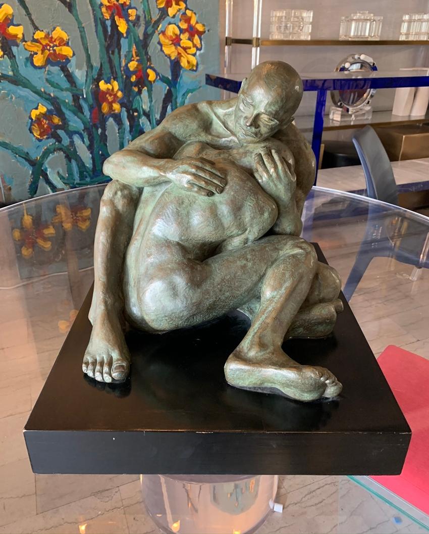 Beautiful bronze sculpture of 2 nude males embracing titled LOVE by Norma Goldberg, dated 1977

The piece can really communicate the love this couple feel for each other and how protective one is of the other.

The piece is mounted on a wooden