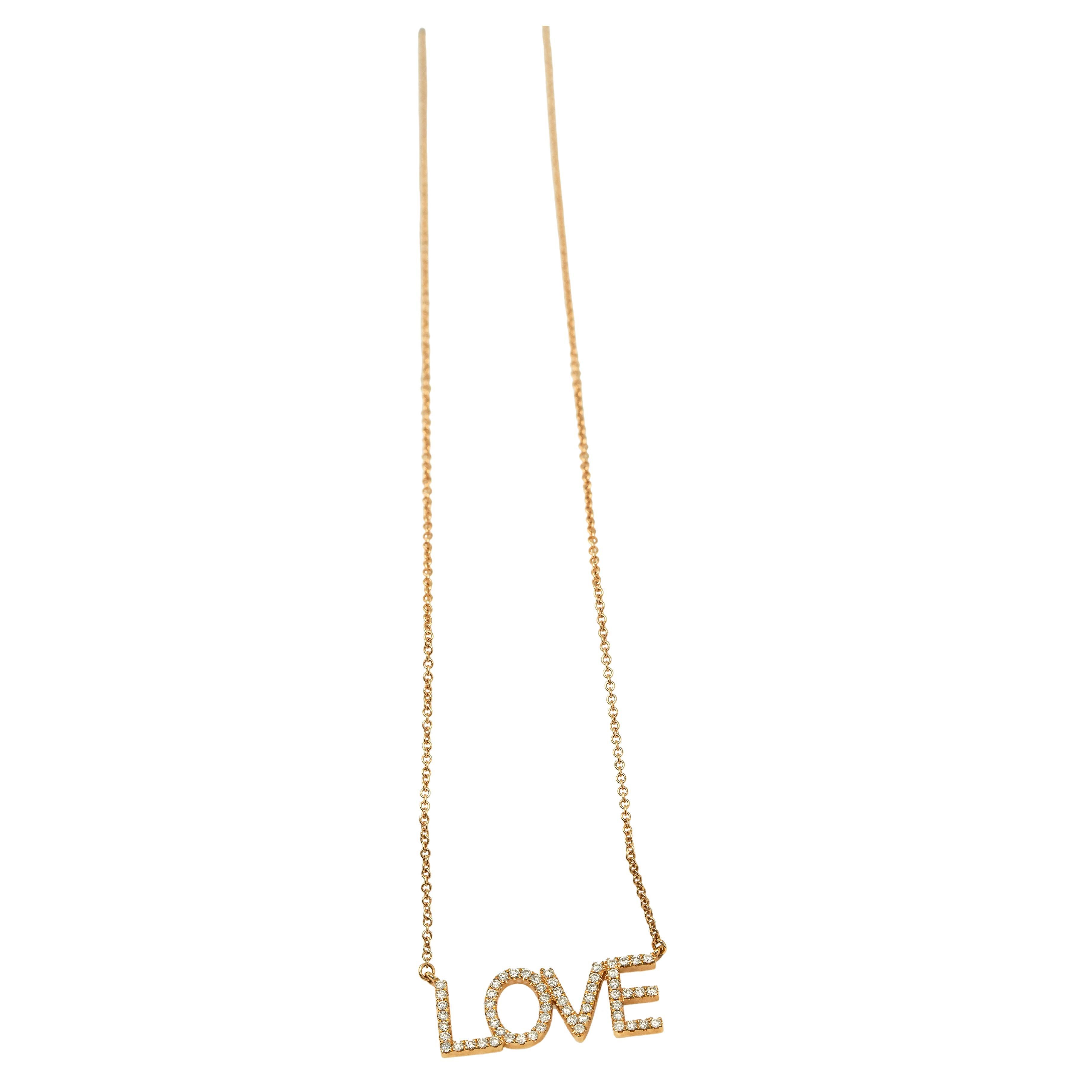 Ciondolo con diamante "LOVE" 0,47 carati.