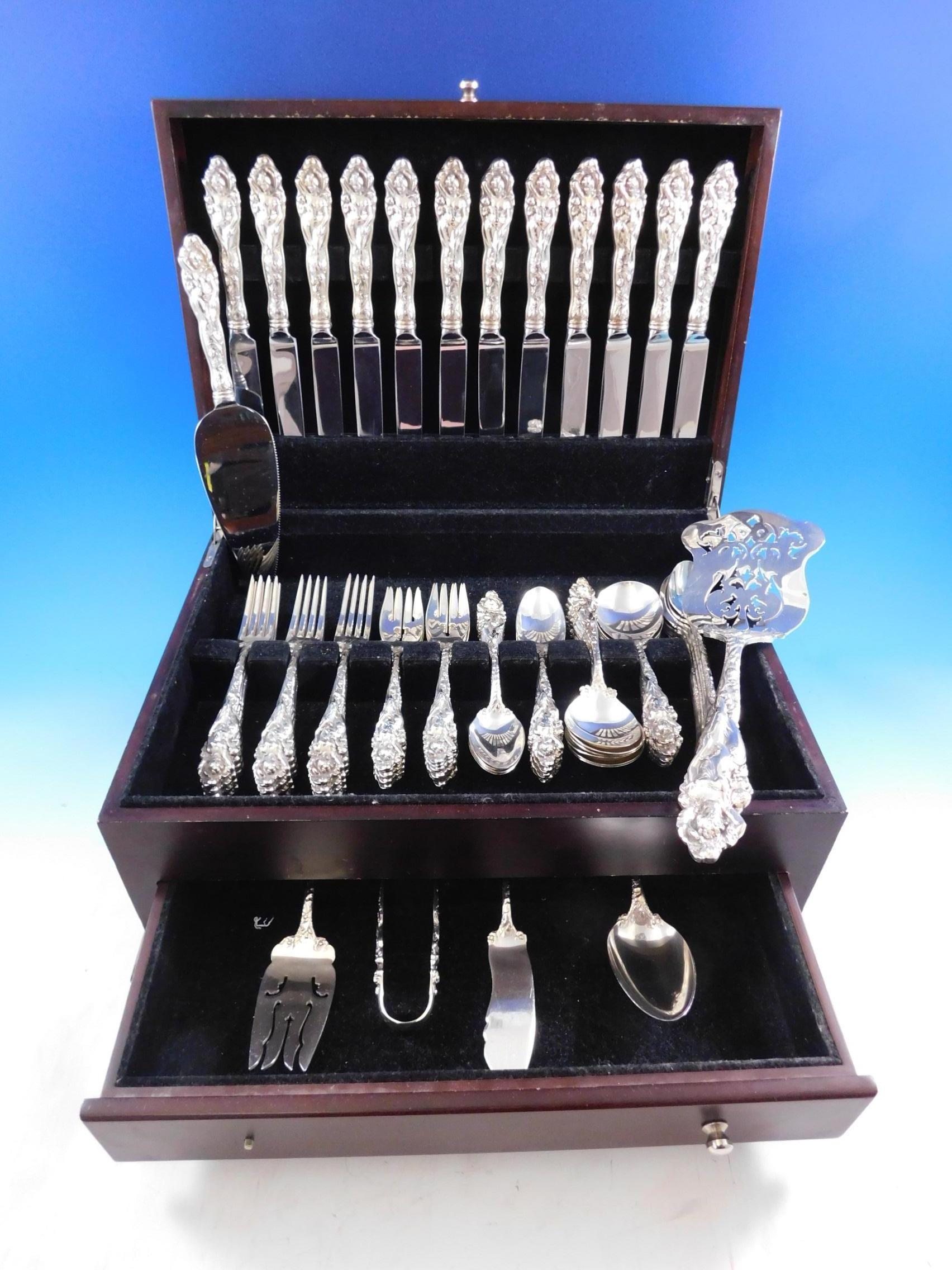 Masterfully crafted Love Disarmed by Reed & Barton sterling silver flatware set, 74 pieces. This set includes:

12 regular knives, 9 3/8