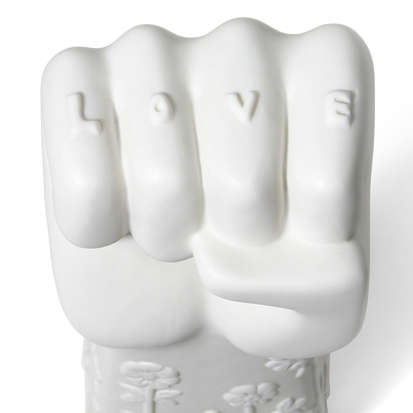 Talk to the Hand. Our statement sculptures are made from high-fired matte porcelain, then poised atop a chic acrylic platform. From your tabletop, mantel or shelf, they're the perfect way to let guests know what you Stand for—peace, love,