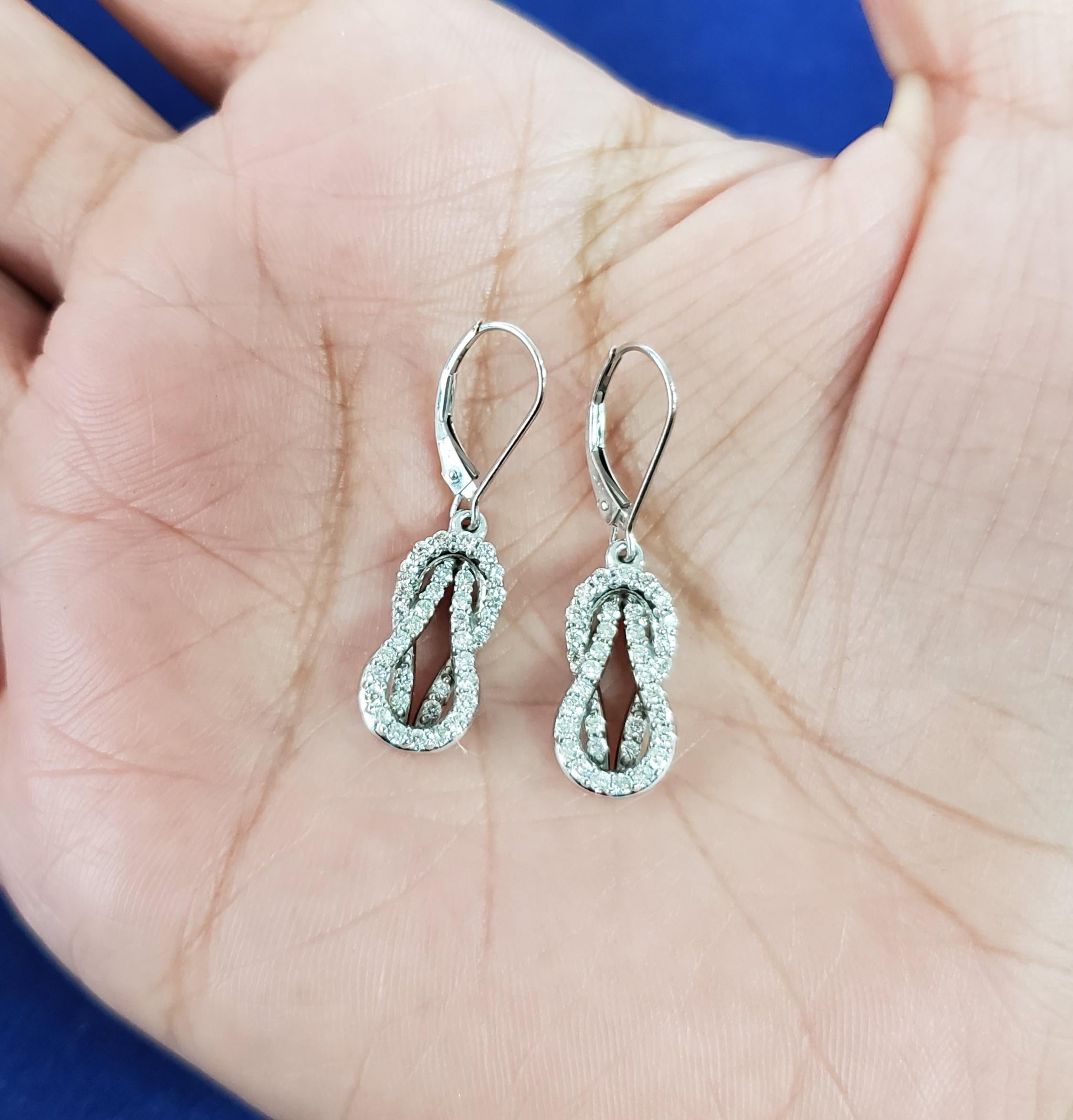 Round Cut Love Knot Drop Dangling Diamond Earrings .75cttw 14K White Gold For Sale