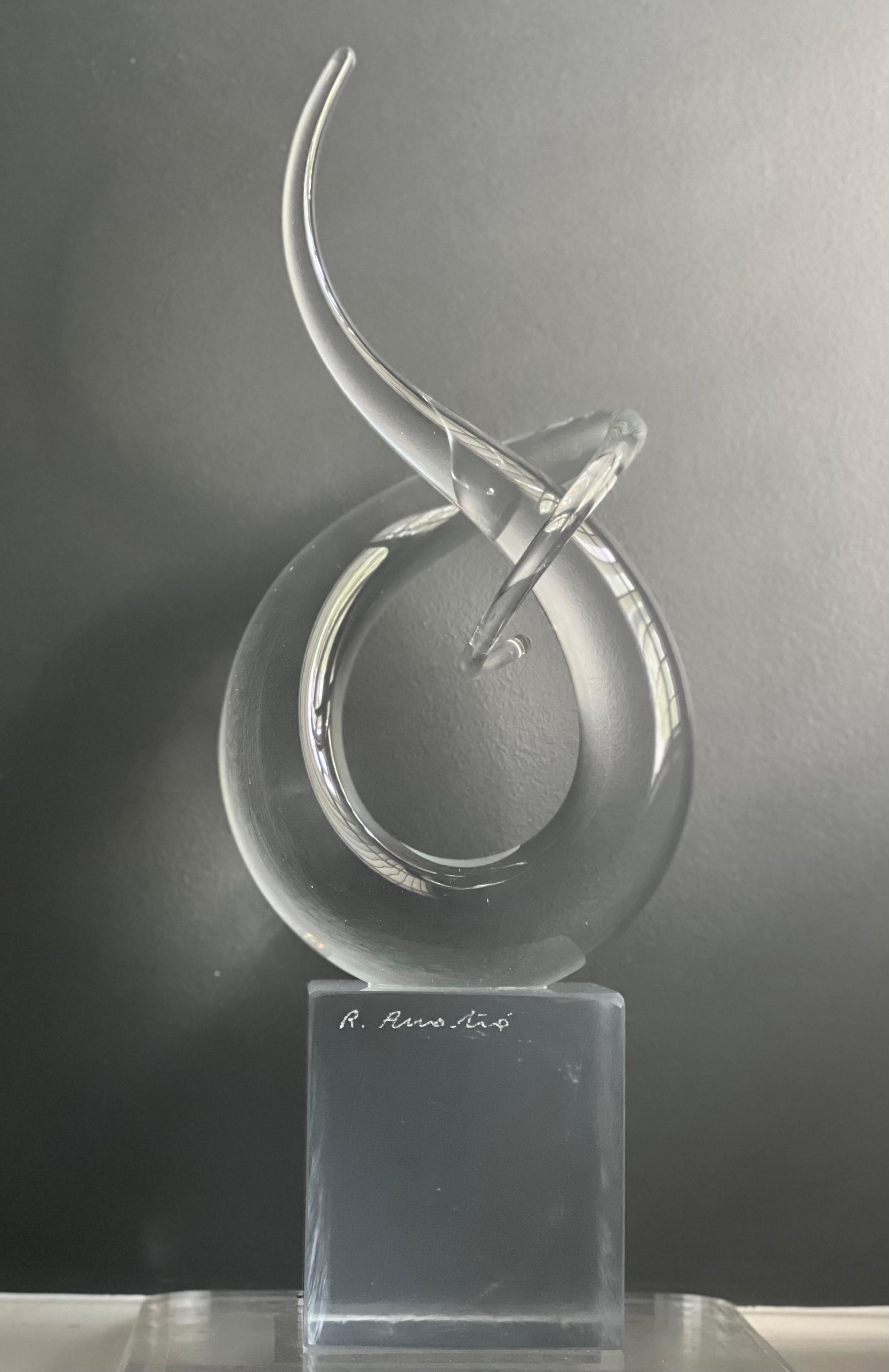 Elegant 'Love Knot' abstract sculpture by Renato Anatrà, signed, Italy.

Representing eternal love, this graceful sculpture is beautifully hand crafted of clear Murano glass by Renato Anatrà. Born in 1943, Anatrà is one of the most prominent