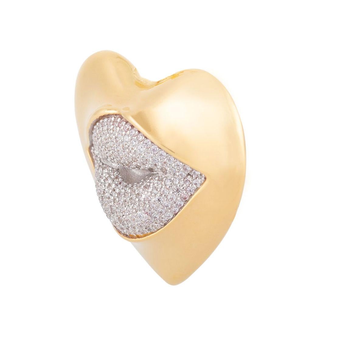 Love starts with the heart and lasts on the lips. This might be the sexiest brooch ever! Our sexy gold statement heart brooch with a diamond kiss. Shine your love on!

Composition: Sterling Silver, 18k gold vermeil and Rhodium plated.
Color: Gold &