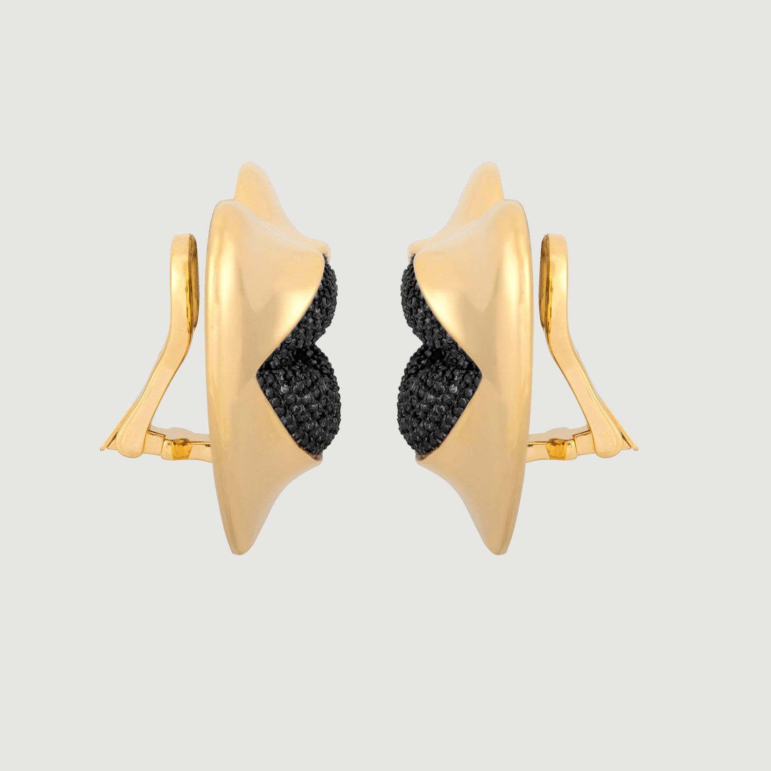 Love starts with the heart and lasts on the lips. These might be the sexiest earrings ever! Our sexy gold statement heart earrings with black diamond kisses. Shine your love on!

Composition: Sterling Silver, 18k gold vermeil and Rhodium