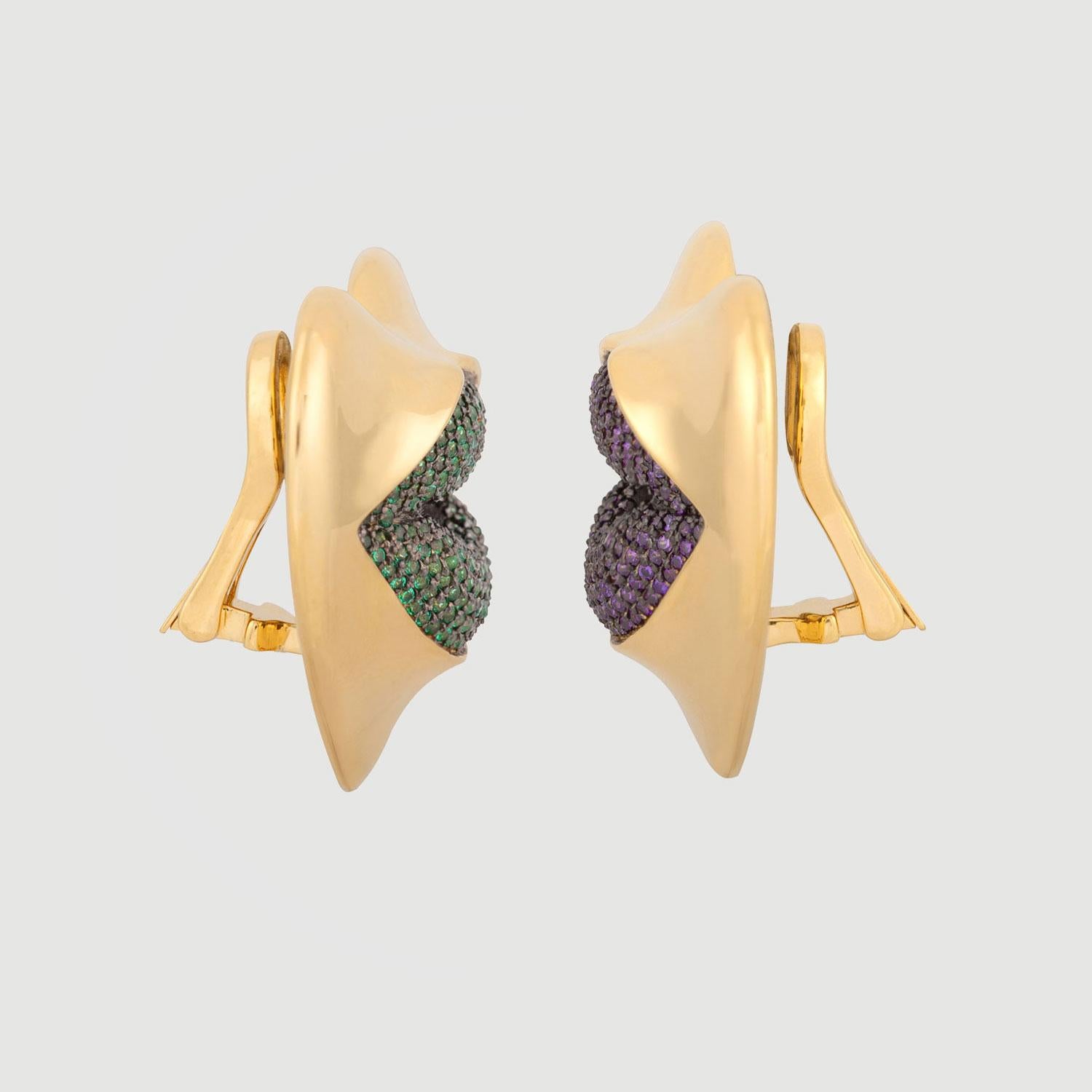 Love starts with the heart and lasts on the lips. These might be the sexiest earrings ever! Our sexy gold statement heart earrings with amethyst and peridot kisses. Shine your love on!

Composition: Sterling Silver, 18k gold vermeil and Rhodium