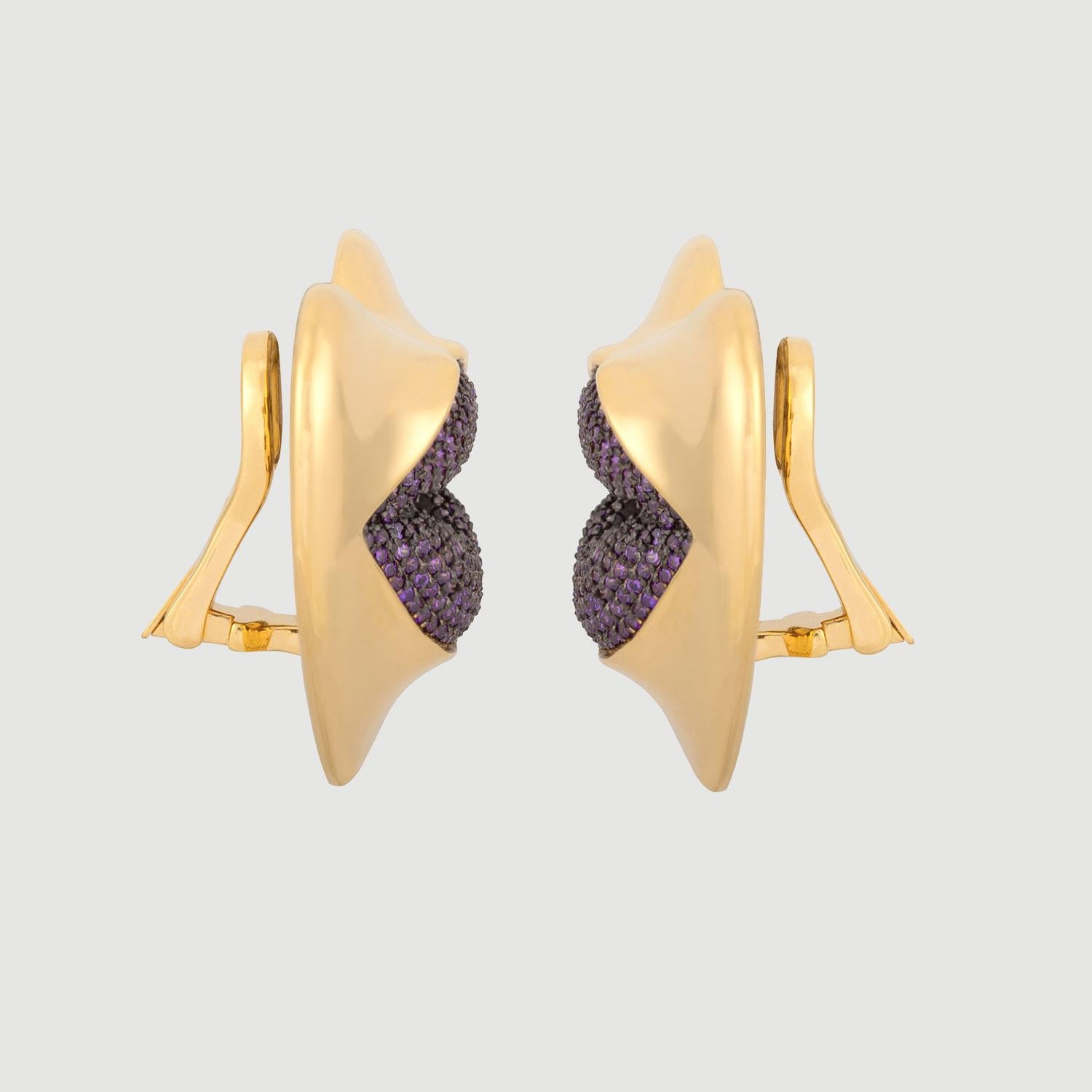 Love starts with the heart and lasts on the lips. These might be the sexiest earrings ever! Our sexy gold statement heart earrings with amethyst kisses. Shine your love on!

Composition: Sterling Silver, 18k gold vermeil and Rhodium plated.
Color: