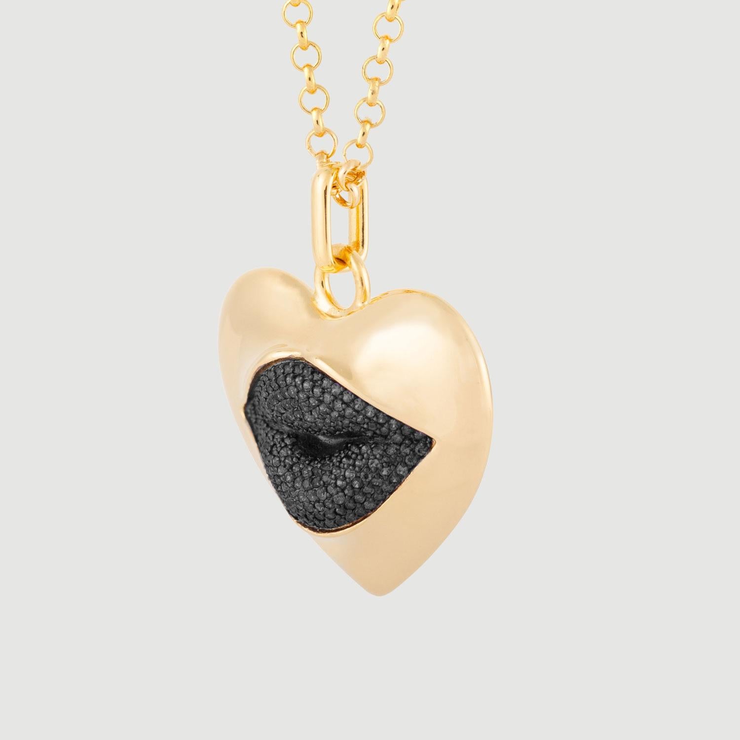 Love starts with the heart and lasts on the lips. This might be the sexiest necklace ever! Our sexy gold statement heart necklace with a black diamond kiss. Shine your love on!

Composition: Sterling silver, 18K gold vermeil, Rhodium plated
Color: