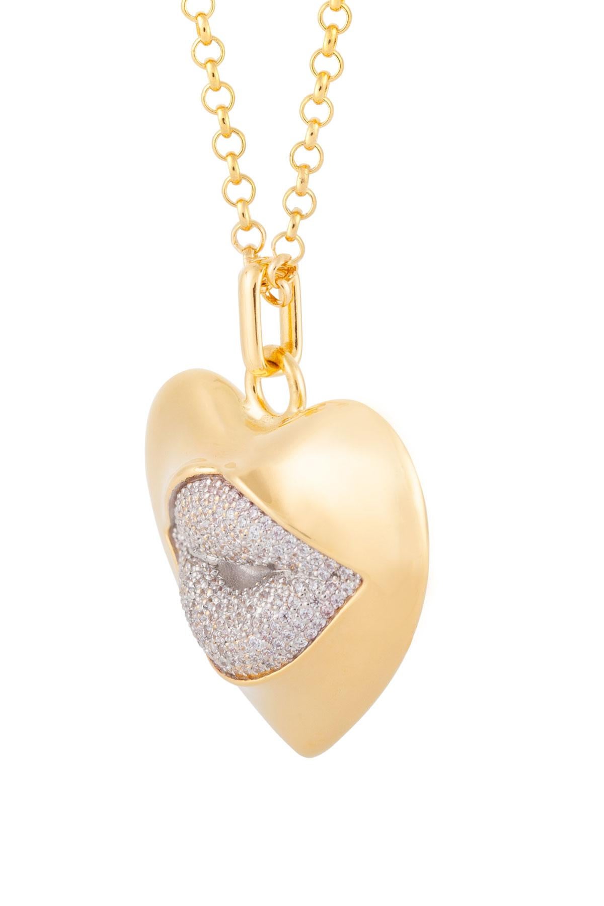 Love starts with the heart and lasts on the lips. This might be the sexiest necklace ever! Our sexy gold statement heart necklace with a diamond kiss. Shine your love on!

Composition: Sterling silver, 18K gold vermeil, Rhodium plated
Color: Gold &