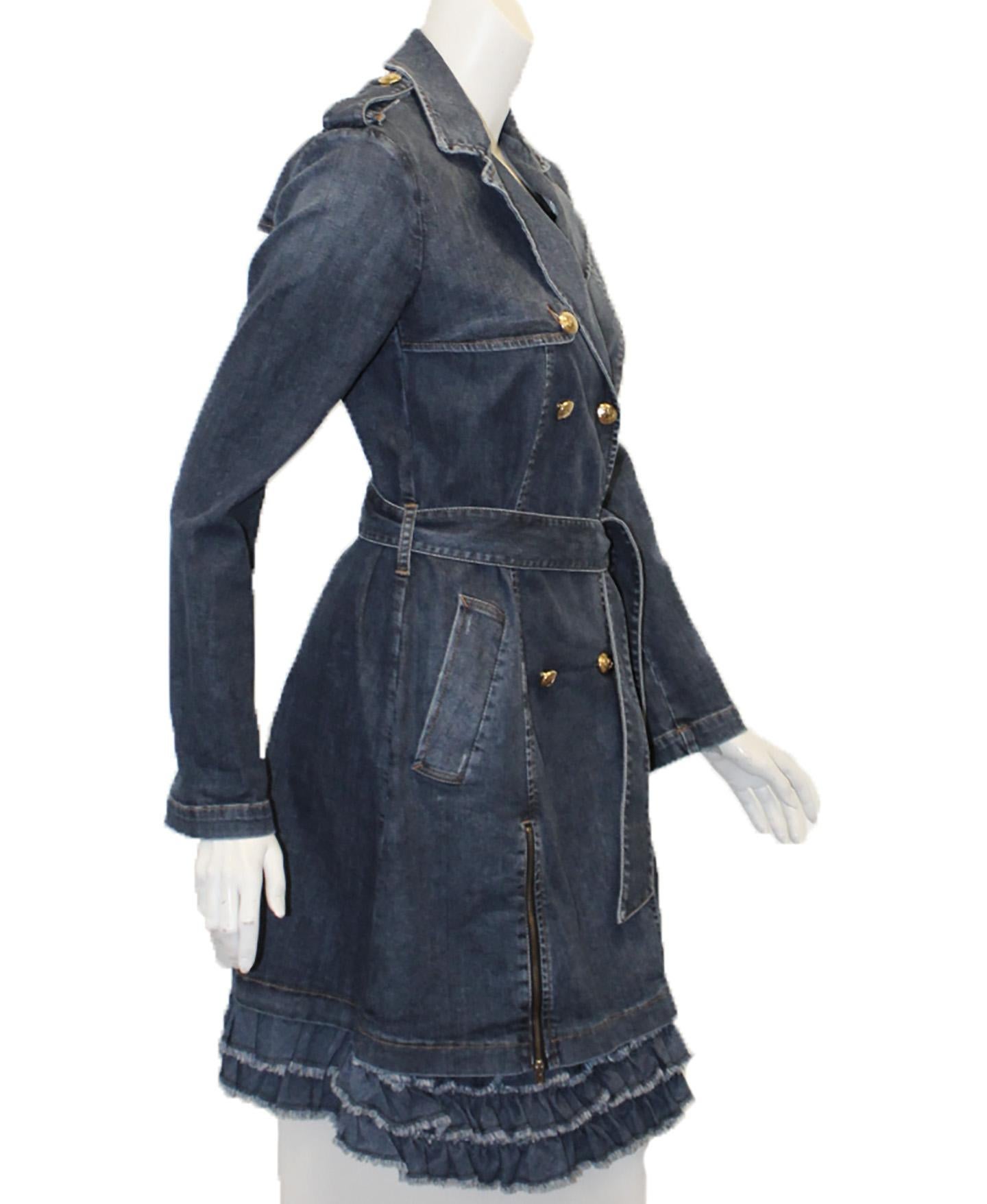 Love Moschino blue denim long sleeve double breasted dress coat is enhanced on the shoulders with epaulets and includes 6 gold tone Love Moschino buttons and one sash at the waist for closure.  As added decorations two zippers at front just below