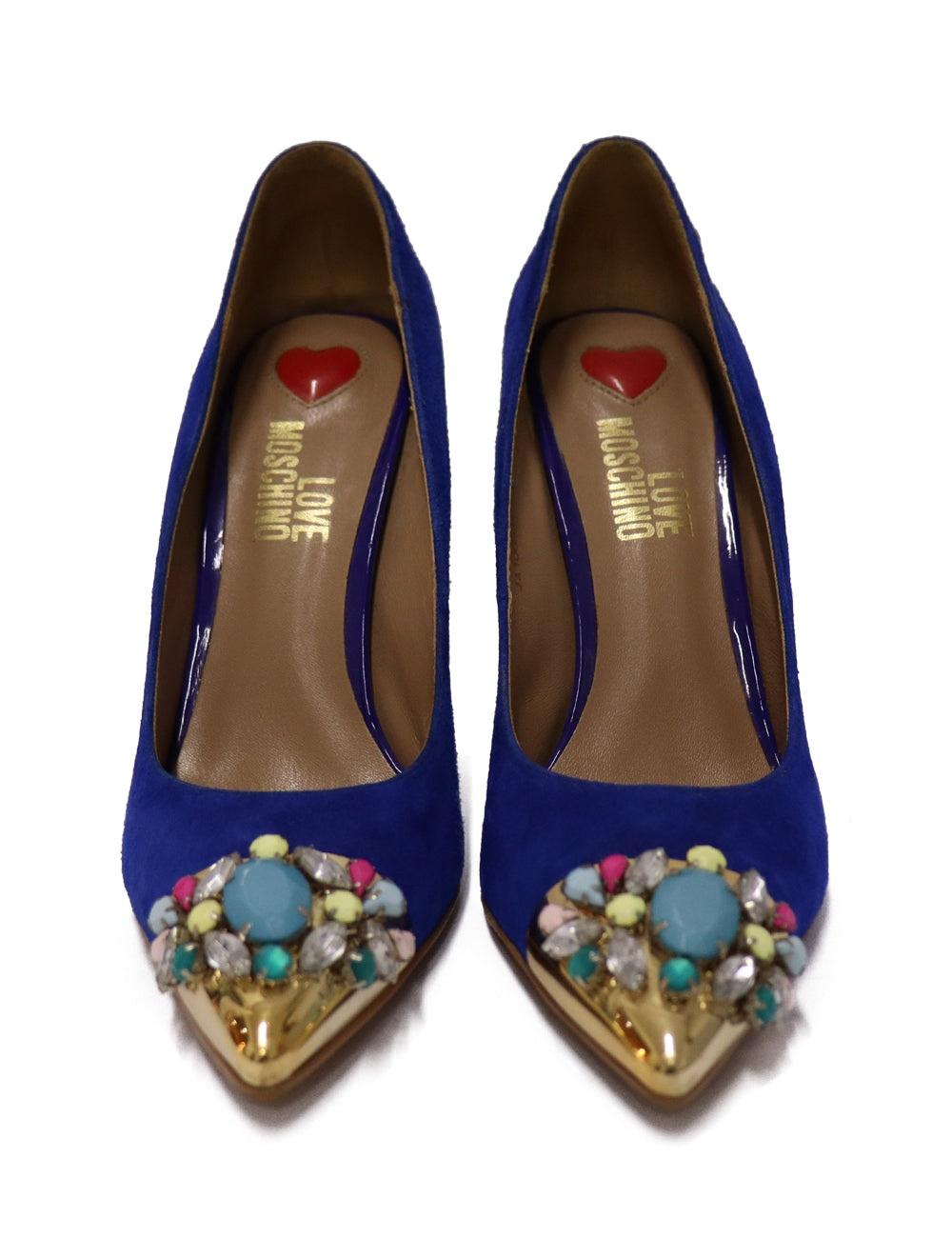 Love Moschino blue suede pumps with a metal gold toe and a multi-colored rhinestone embellishments.

Additional information:
Material: Suede
Size: EU 38
Measurements: Heel: 10 cm 
Overall condition: Good
Interior Condition: Signs of use
Exterior