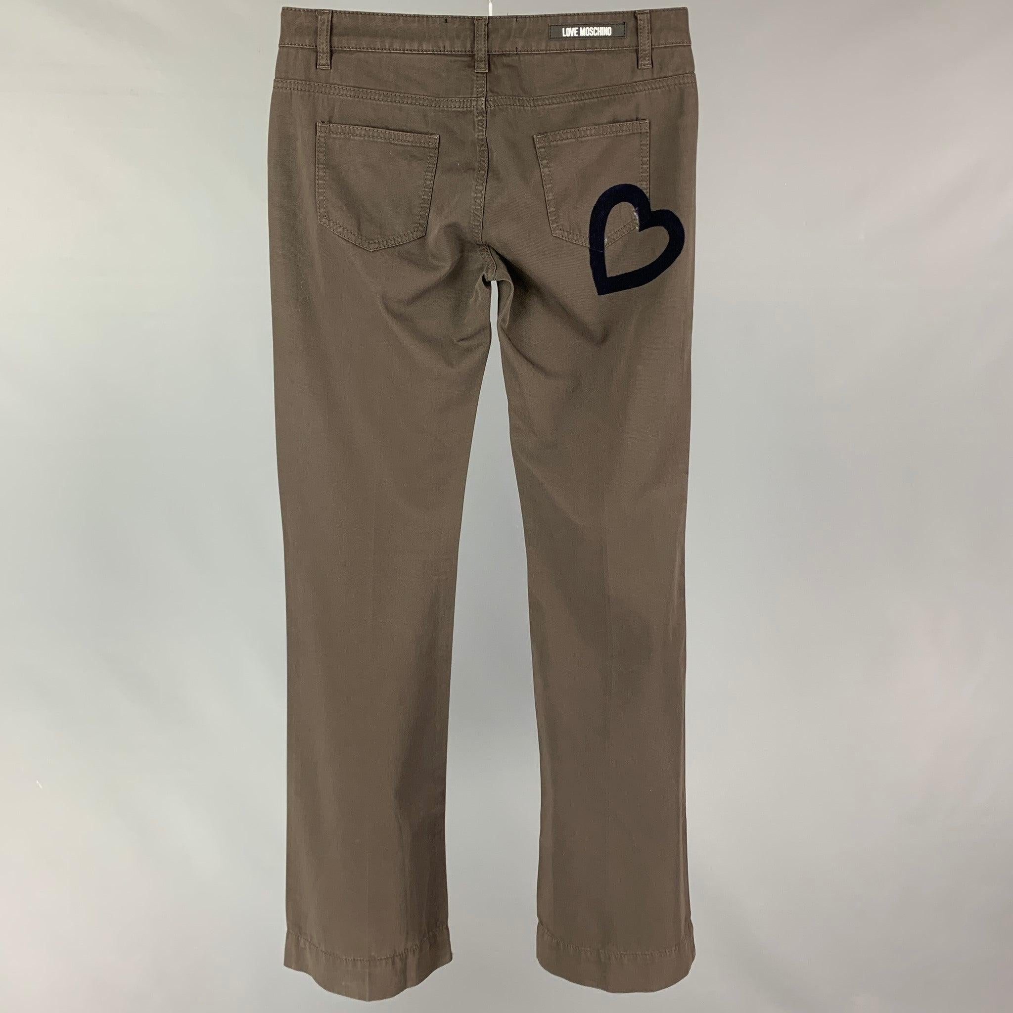 LOVE MOSCHINO casual pants comes in a brown cotton featuring a wide leg, back velvet heart detail, and a button fly closure. Includes tags. Made in Italy.
Very Good
Pre-Owned Condition. 

Marked:   26 

Measurements: 
  Waist: 30 inches  Rise: 8
