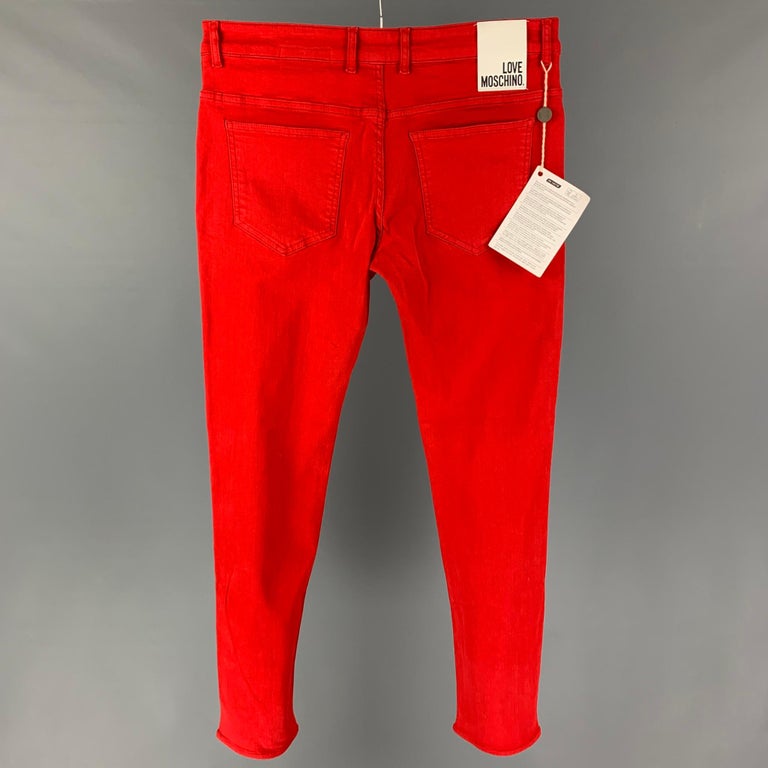 LOVE MOSCHINO jeans comes in a red cotton featuring a skinny fit and a zip fly closure. 

New With Tags.
Marked: 31

Measurements:

Waist: 34 in.
Rise: 10 in.
Inseam: 32 in. 