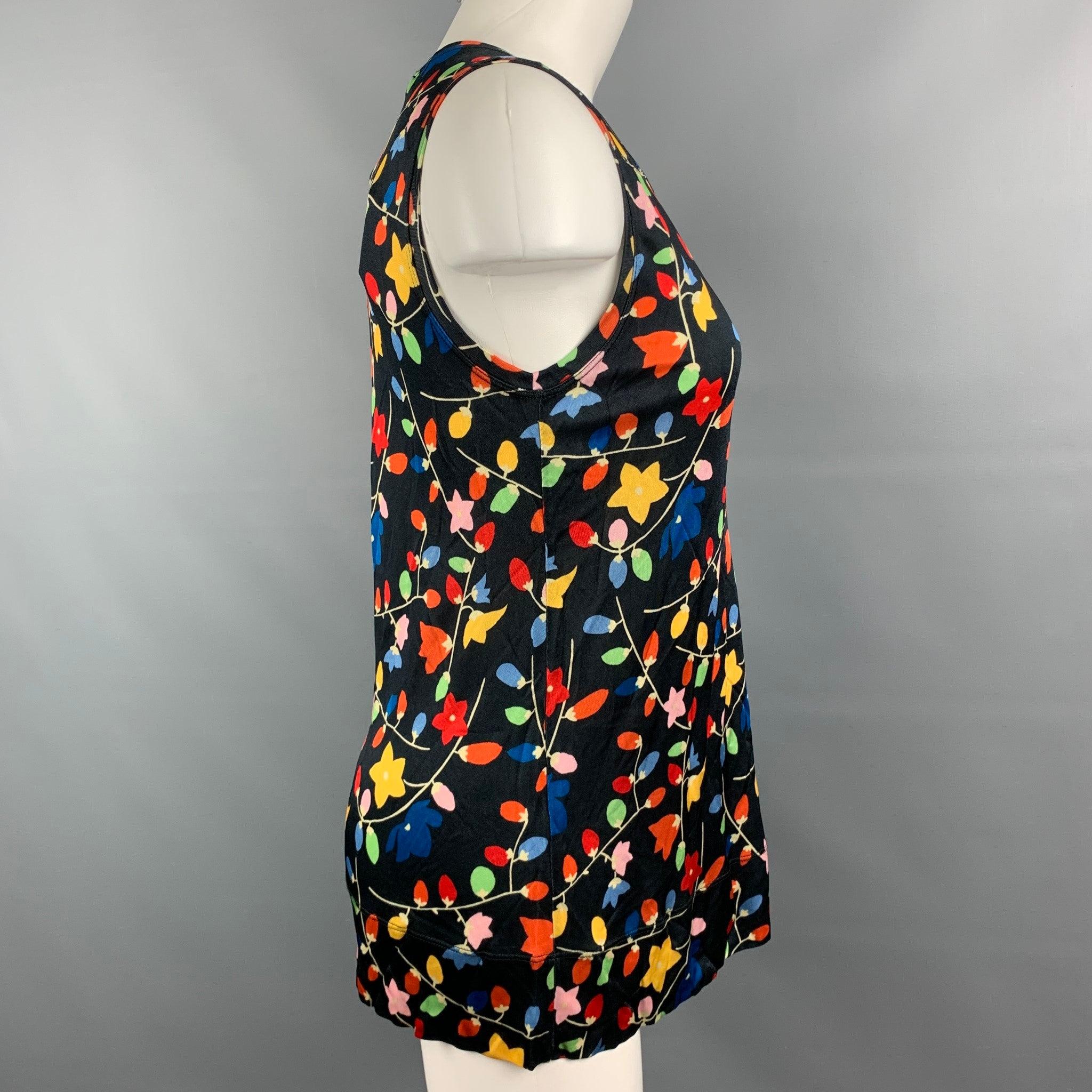 LOVE MOSCHINO blouse comes in a black viscose jersey material, with a multicolor floral print, a round neck, a black bow, sleeveless.New with Tags. 

Marked:   D 36 / GB 8 / F 36 / USA 4 / I 40 

Measurements: 
 
Shoulder: 14.5 inches  Bust:
32