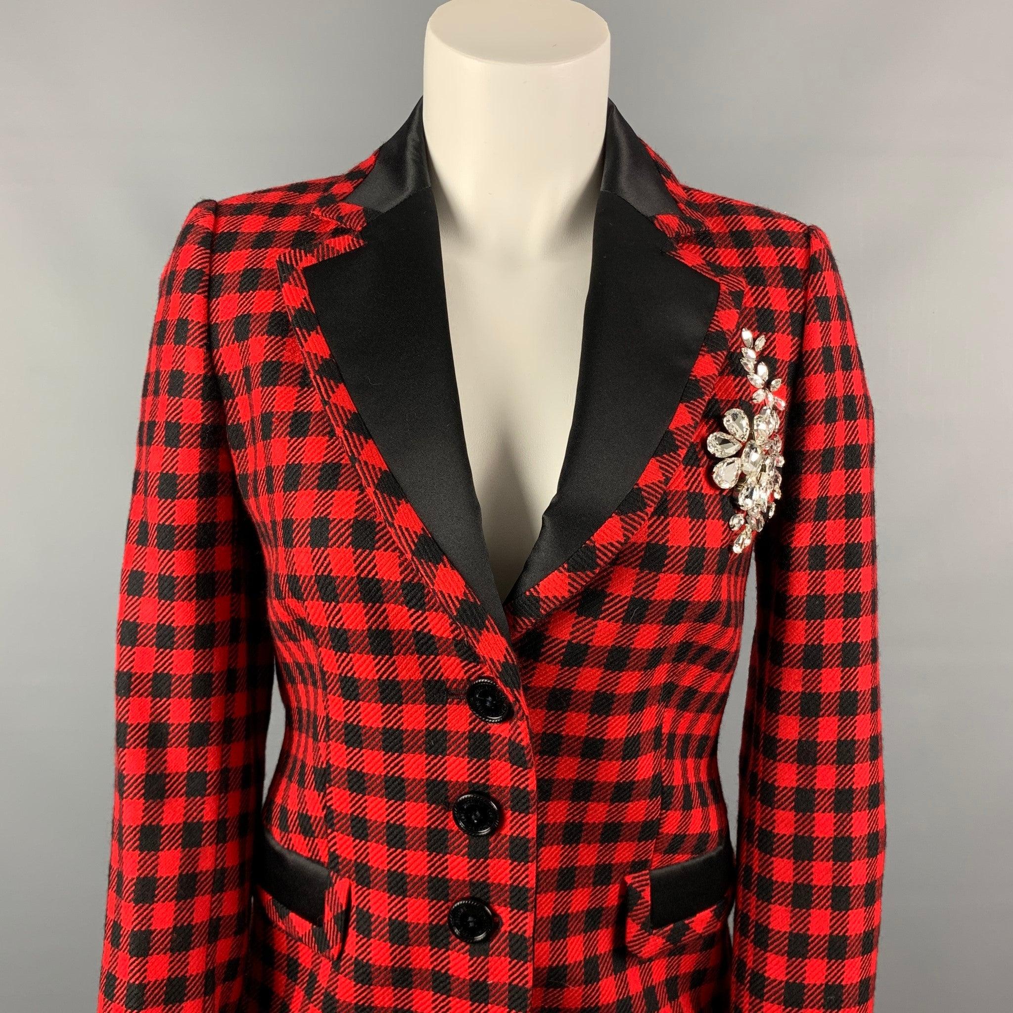 LOVE MOSCHINO jacket comes in a red & black
 gingham wool with satin trim featuring a notch lapel, rhinestone detail, flap pockets, and a three button closure. Made in Italy.Very Good Pre-Owned Condition. 

Marked:   D 36 / GB 8 / F 36 / USA 4 / I