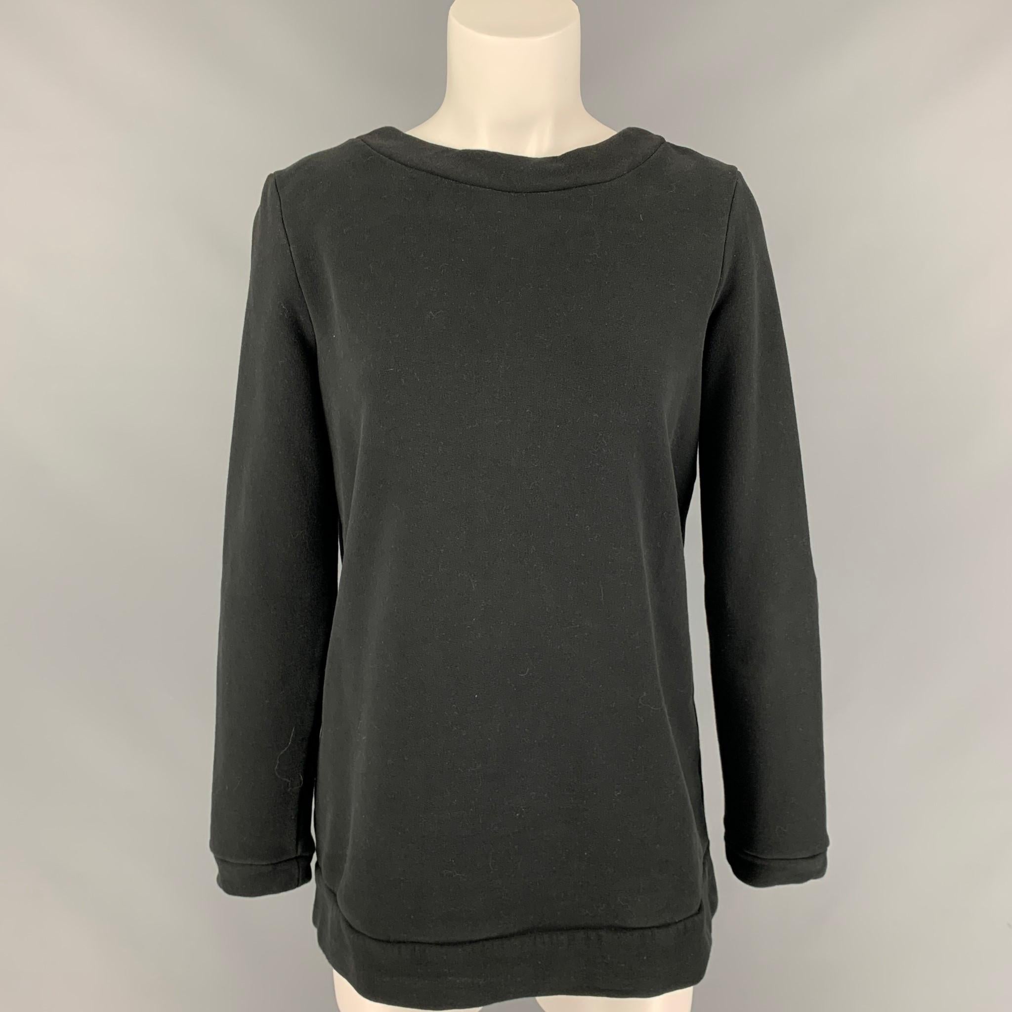 LOVE MOSCHINO sweater comes in a black cotton / polyester featuring back brass zipper details and a scoop neck. First display picture would be the back of the sweater.

Very Good Pre-Owned Condition.
Marked: D 38 / GB 10 / F 38 / USA 6 / I