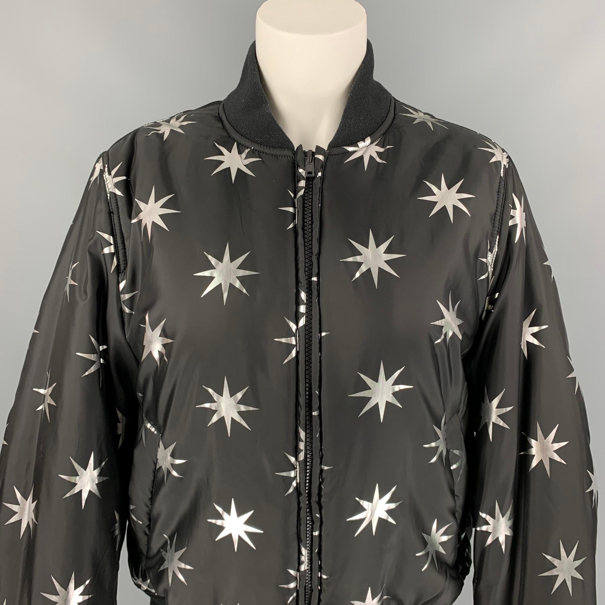 LOVE MOSCHINO jacket comes in a black & silver star print polyester featuring a bomber style, ribbed hem, slit pockets, and a full zip closure. 

Very Good Pre-Owned Condition.
Marked: D 38 / GB 10 / F 38 / USA 6 / I 42

Measurements:

Shoulder: 17