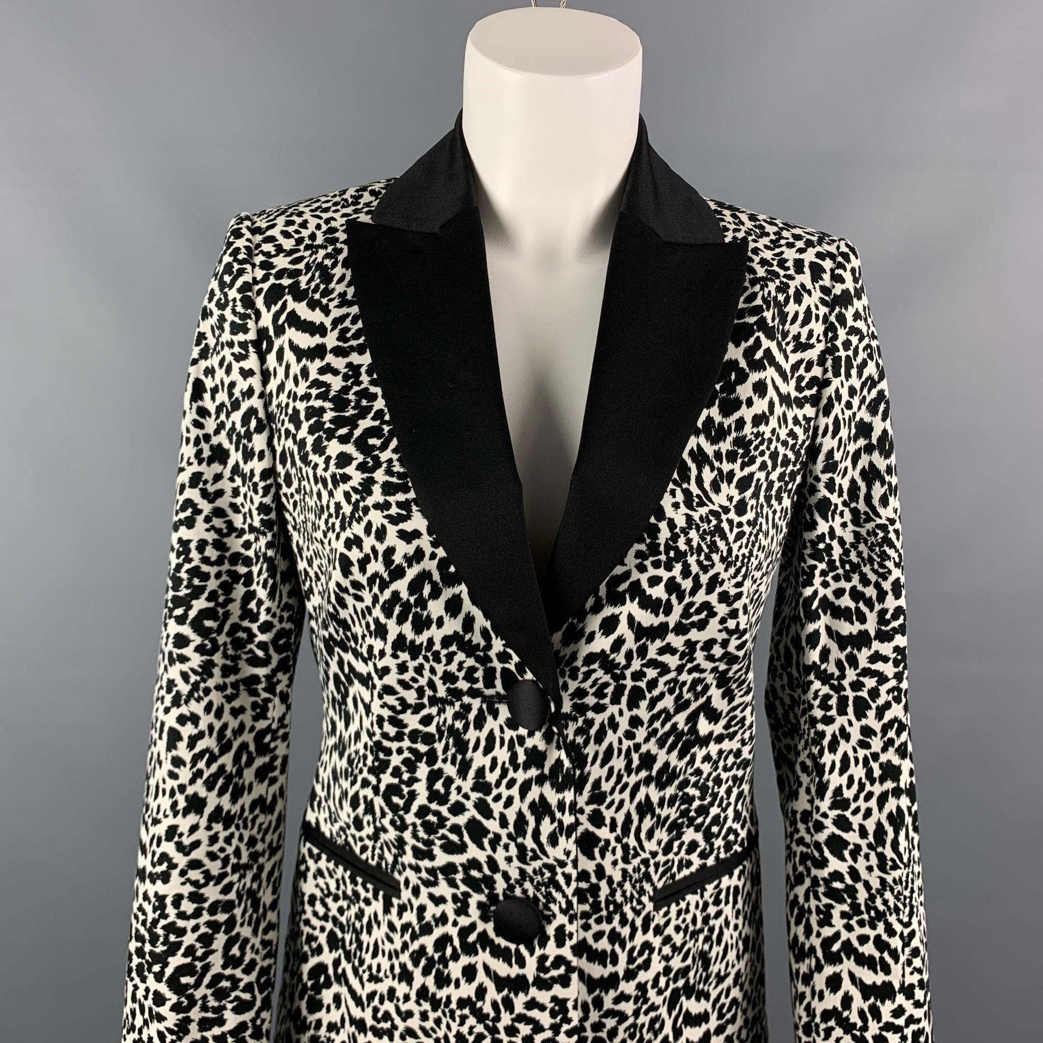 LOVE MOSCHINO jacket comes in a black & white print cotton with a full liner featuring a satin collar, slit pockets, and double button closure.
 New With Tags. 

Marked:   D 38 / GB 10 / F 38 / USA 6 / I 42
   

Measurements: 
 
Shoulder: 15 inches 
