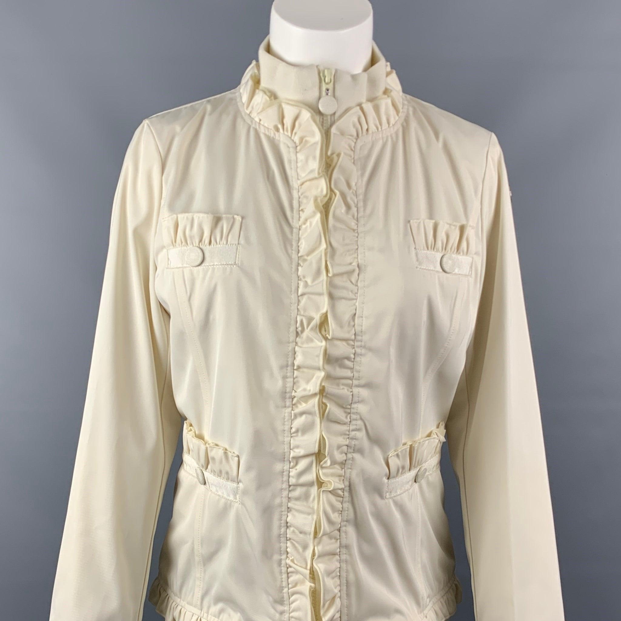 LOVE MOSCHINO jacket comes in a cream polyester with a full liner featuring a high collar, ruffled design, ribbon detail, front pockets, silver tone logo, and a full zip up closure.Very Good Pre-Owned Condition. 

Marked:   D 38 / GB 10 / F 38 / USA
