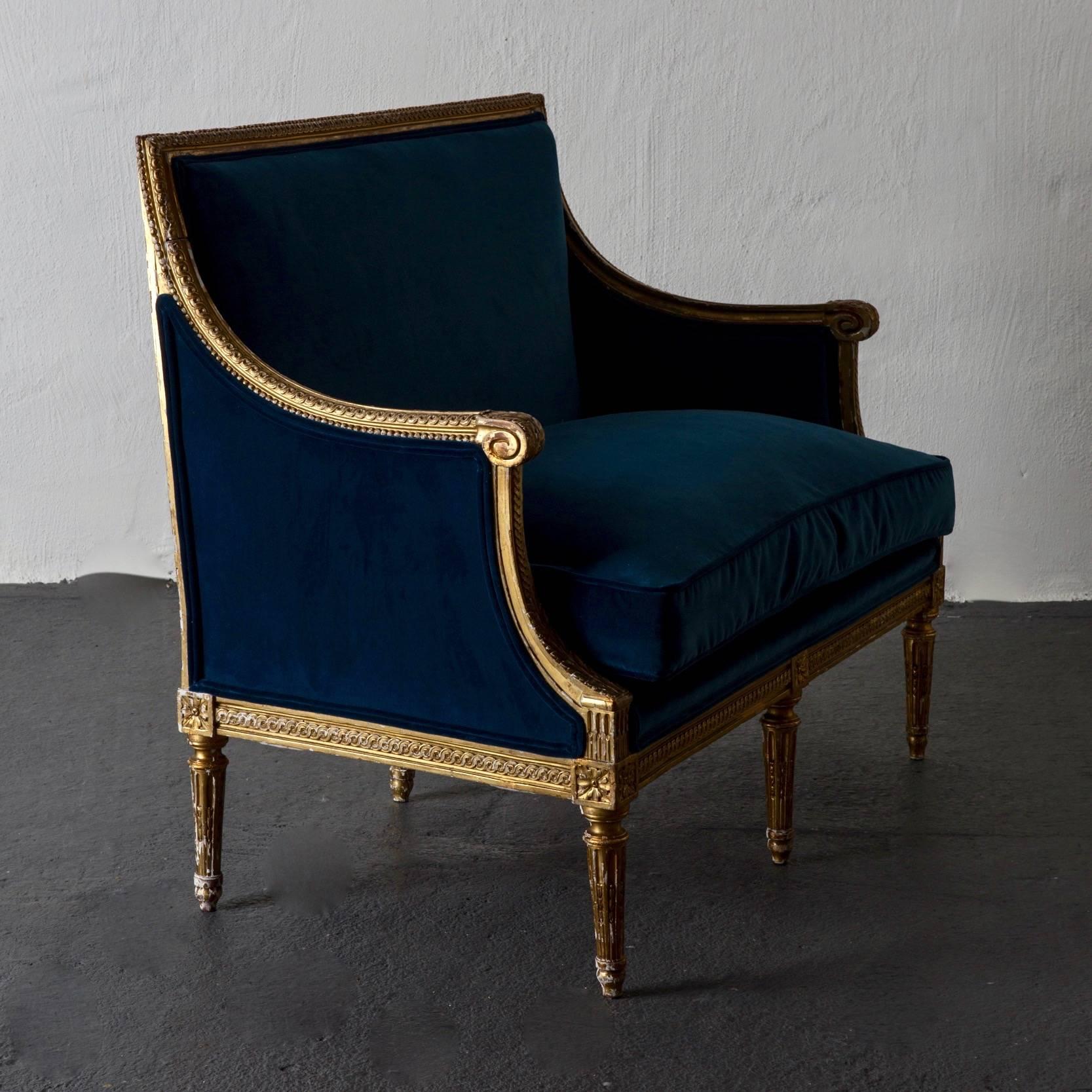 Sofa Bench Love Seat Neoclassical Louis XVI Period Gilt Wood Blue Velvet France. A sofa / love seat made during the louis XVI period. Gilt wood frame with carvings such as pearls beading board and channeled legs. Upholstered in a blue cotton