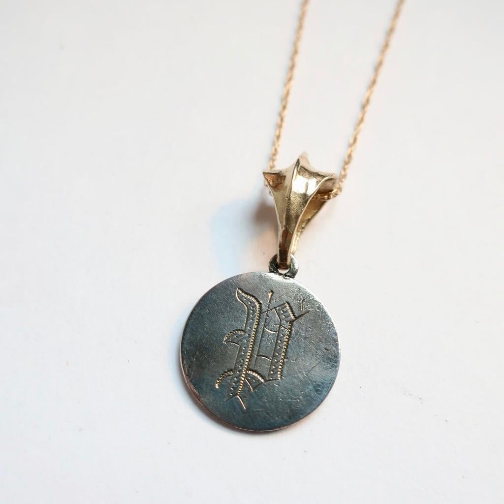 Love Tokens were common in the Victorian Era as a way to express your admiration to a loved one. Often engraved on dimes and strung on necklaces or made into pins. This one is dated 1859, the dime is solid sterling and the bail os 14 carat yellow