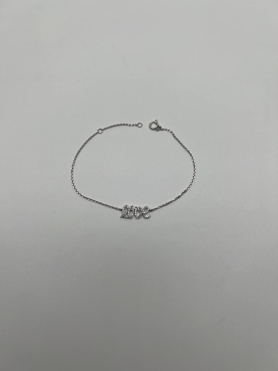 Features a fine chain with a central 