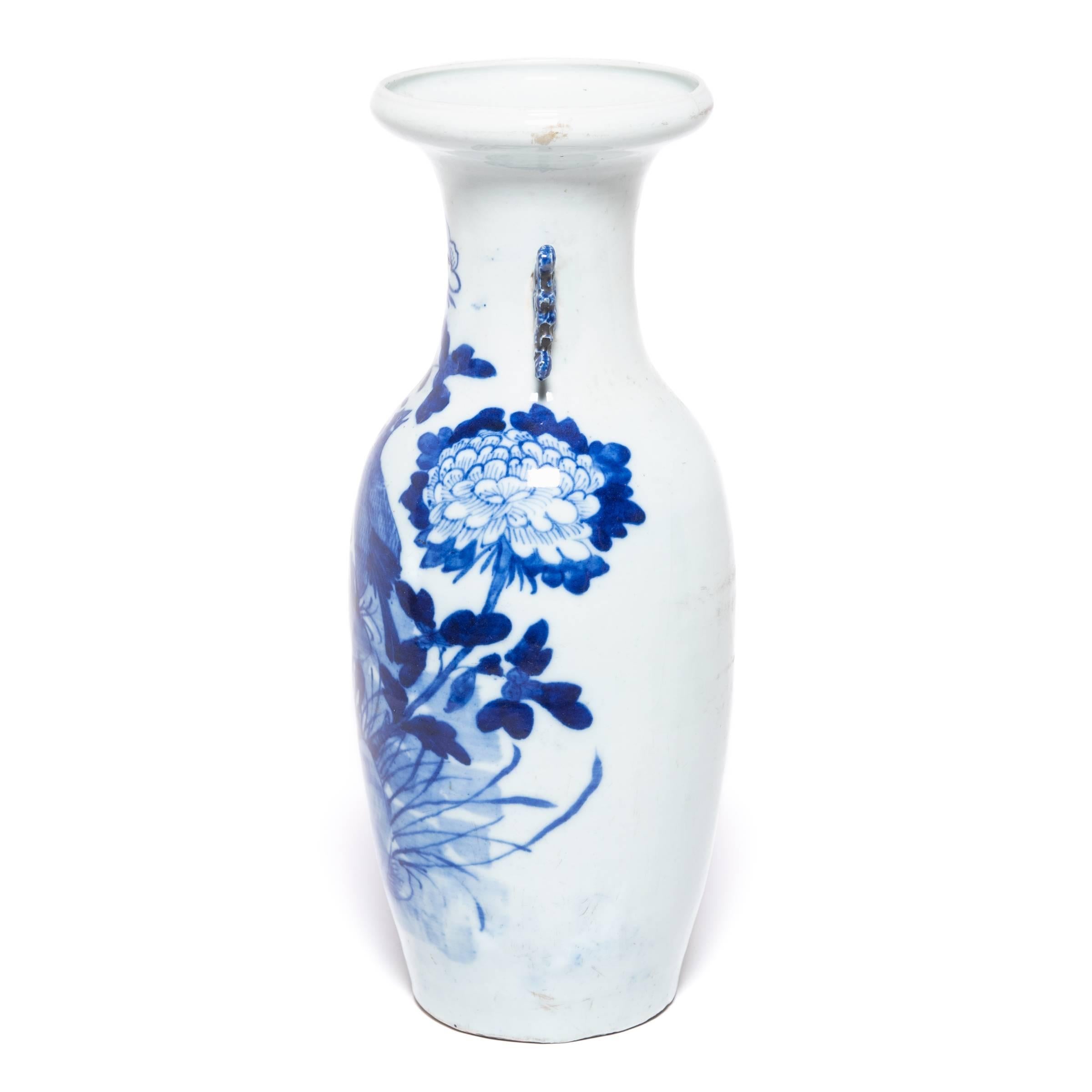 Replete with joyous symbols for a happy marriage, this white porcelain phoenix tail vase was likely given as a newlywed gift. Lavishly decorated with pale washes and deep pools of cobalt blue, the vase depicts a pair of magpies, symbols of double