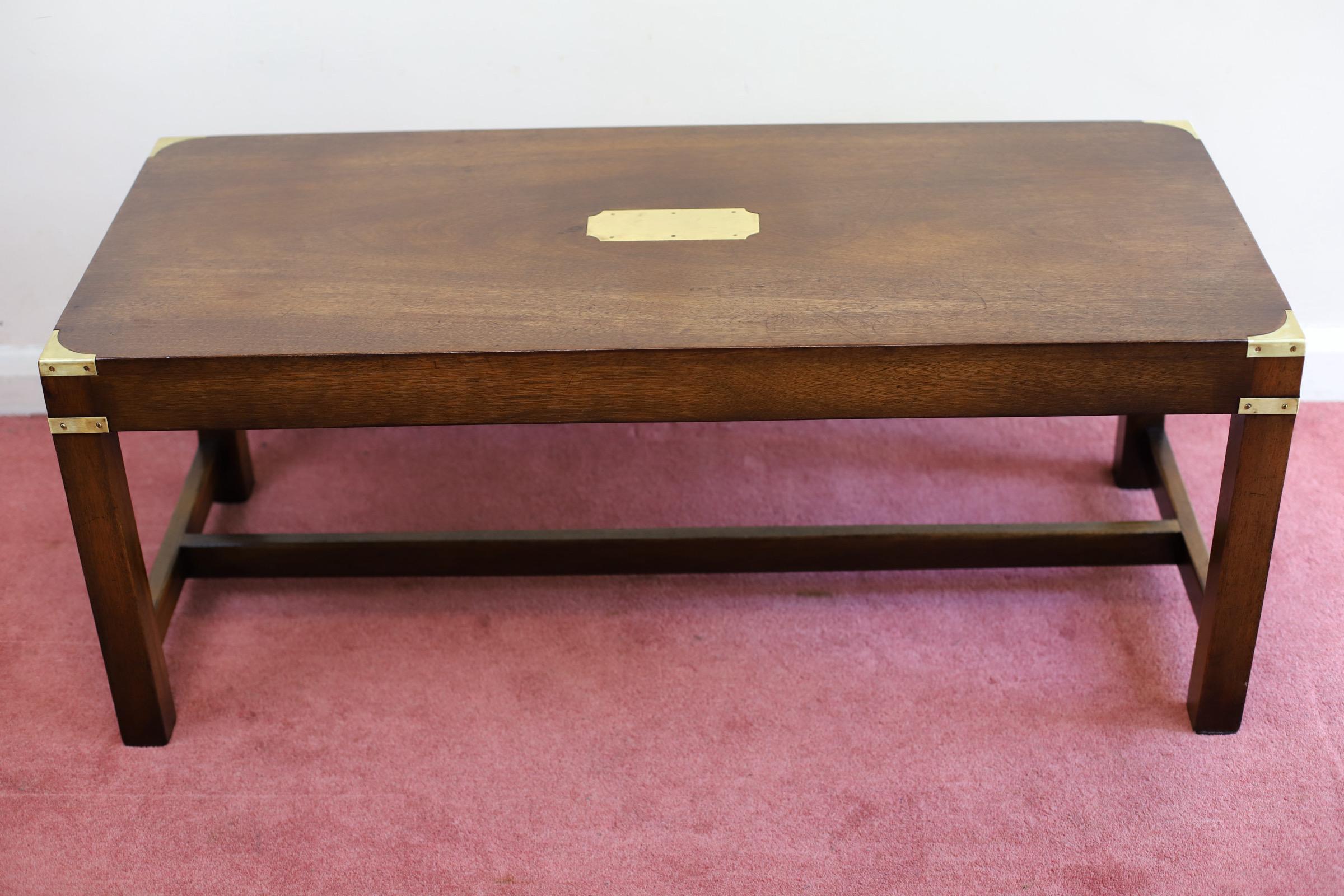 We delight to offer for sale this Beautiful Antique Campaign style oak coffee table in excellent condition . It has a brass plaque on the top & military style corner fittings. This table is very well constructed with strong legs joined by cross